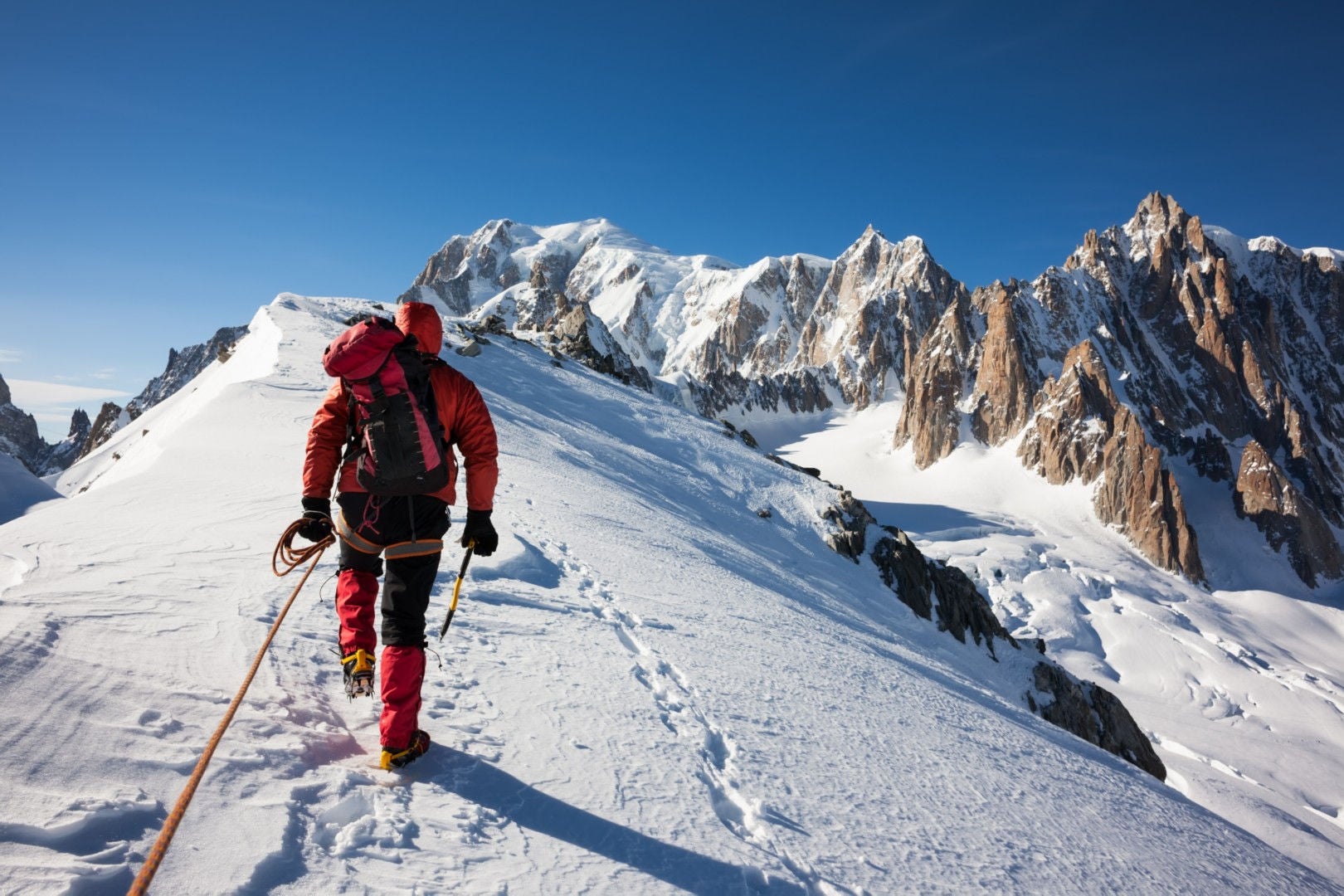 climbers approach the mountain top