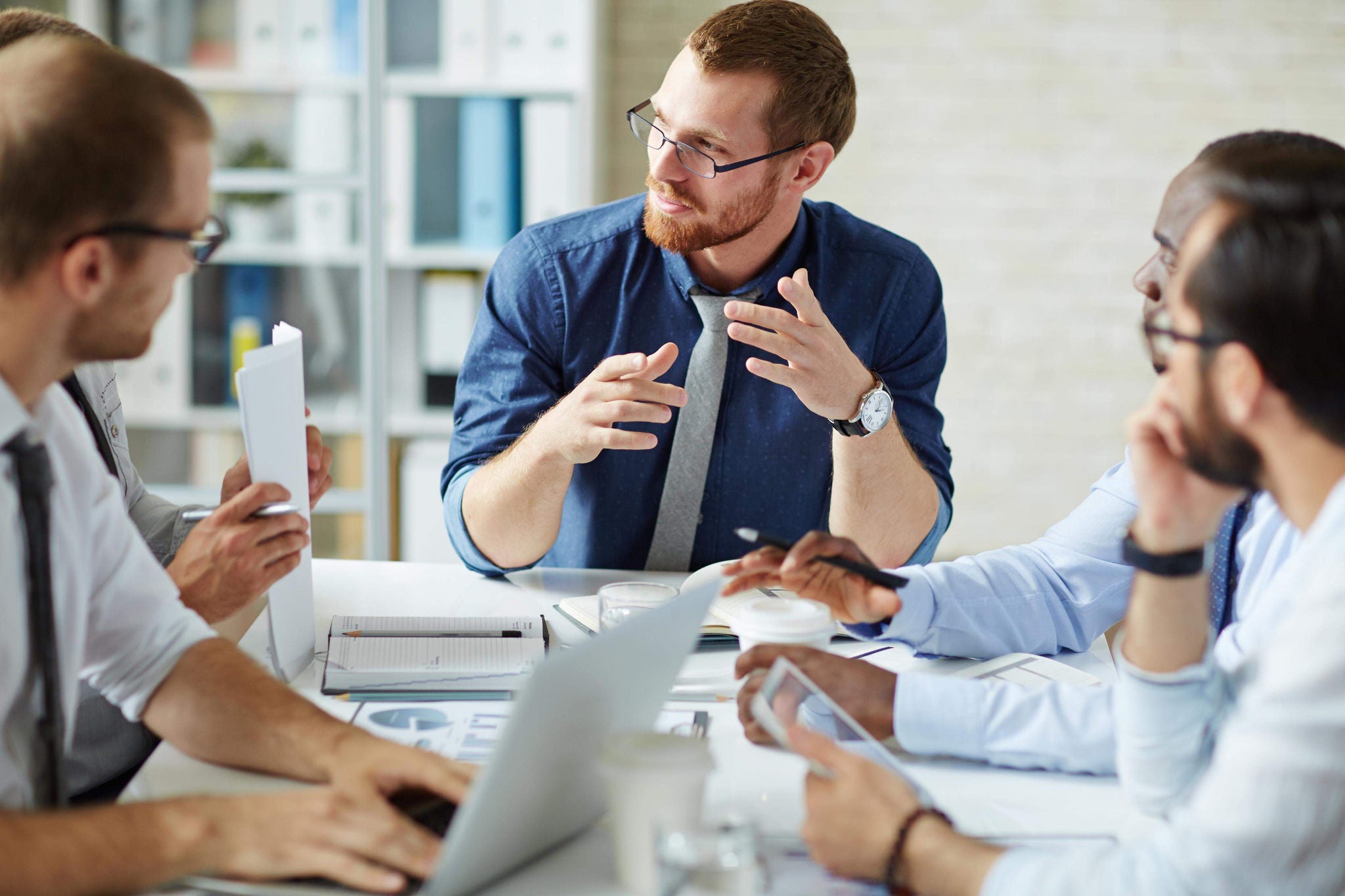 Employees listening to their colleague