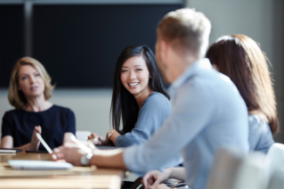 Group of professionals talking with each other