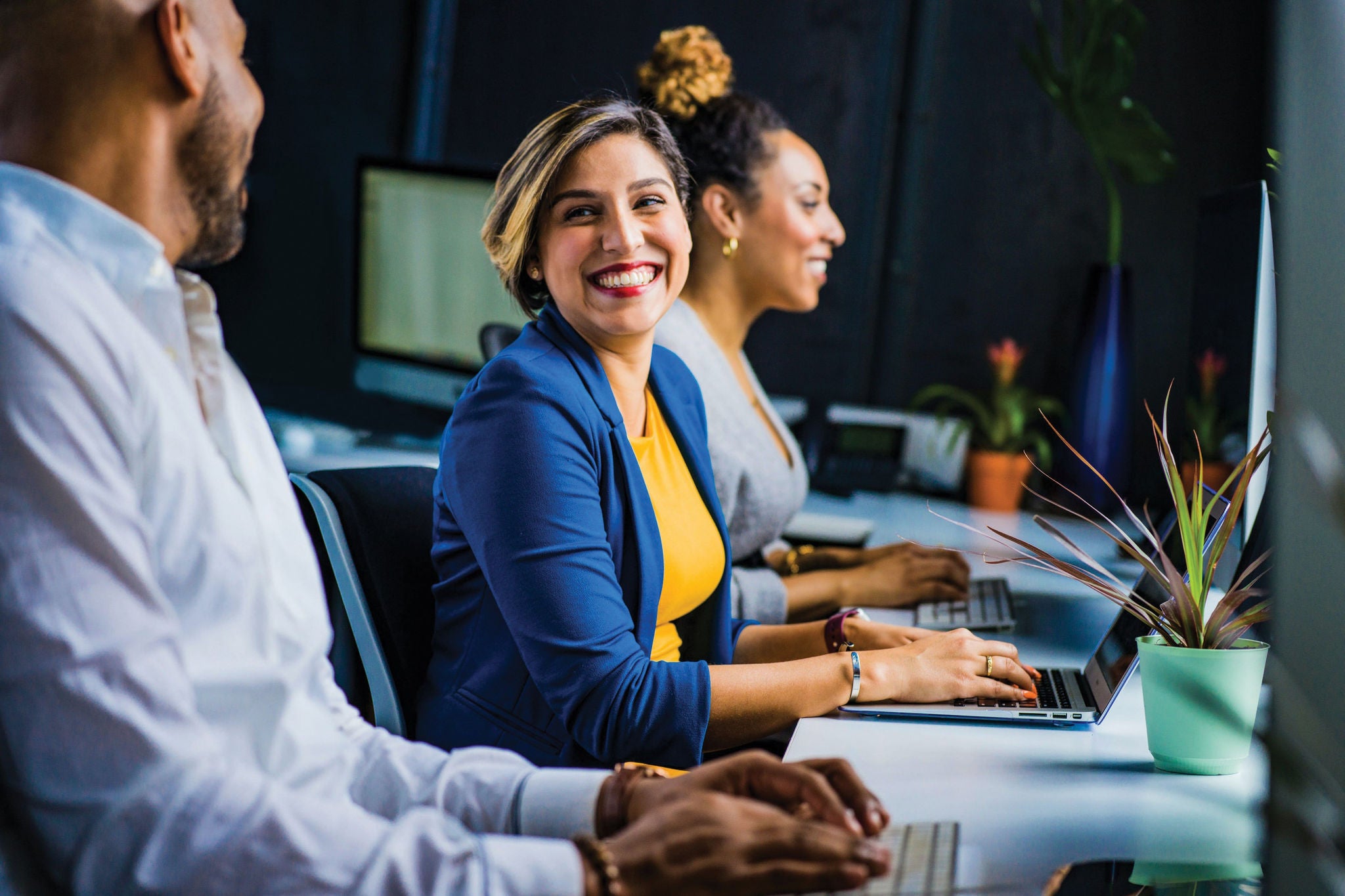 A group of professionals working in the office