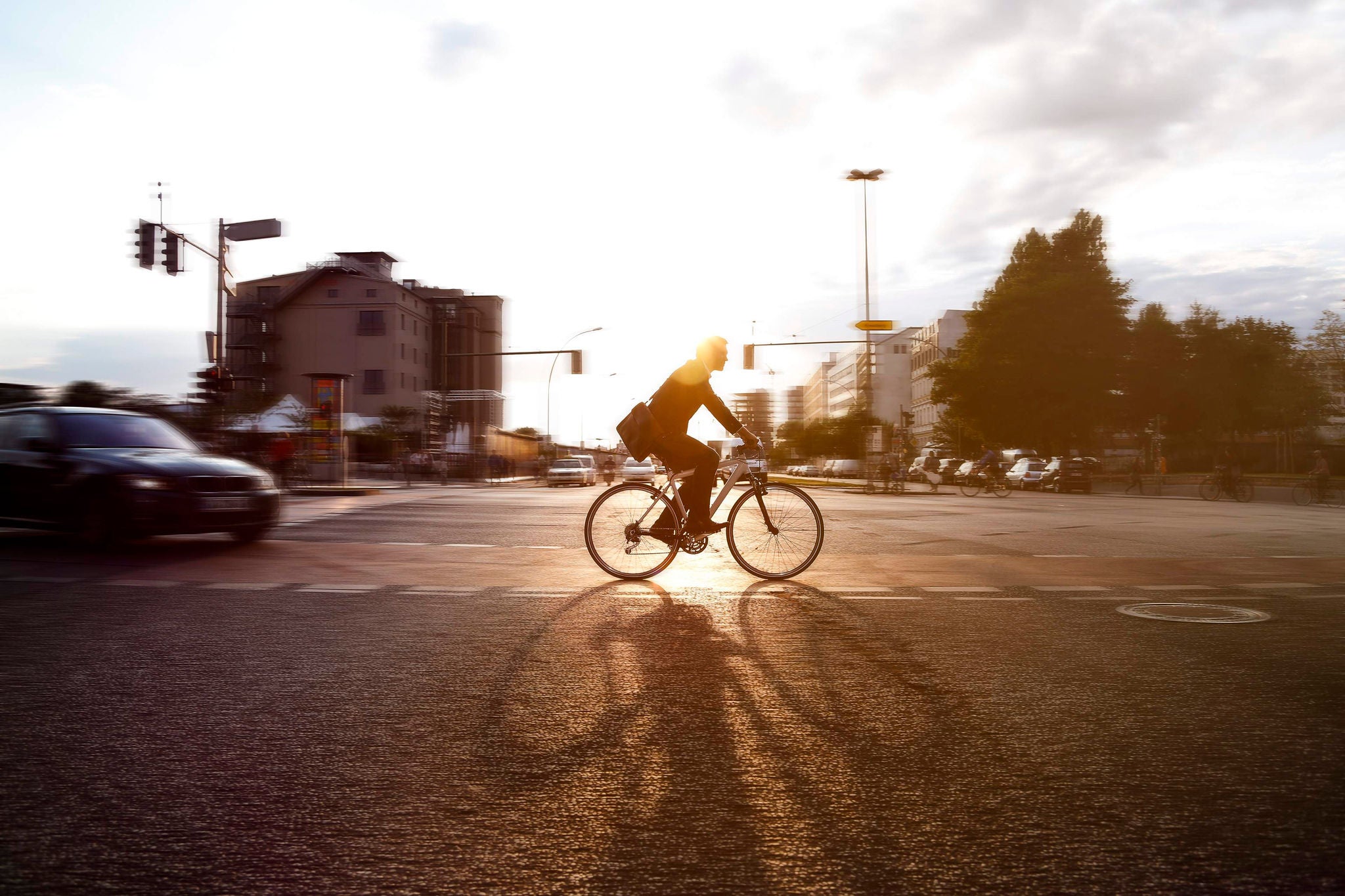 Businessman cycling in city berlin germany