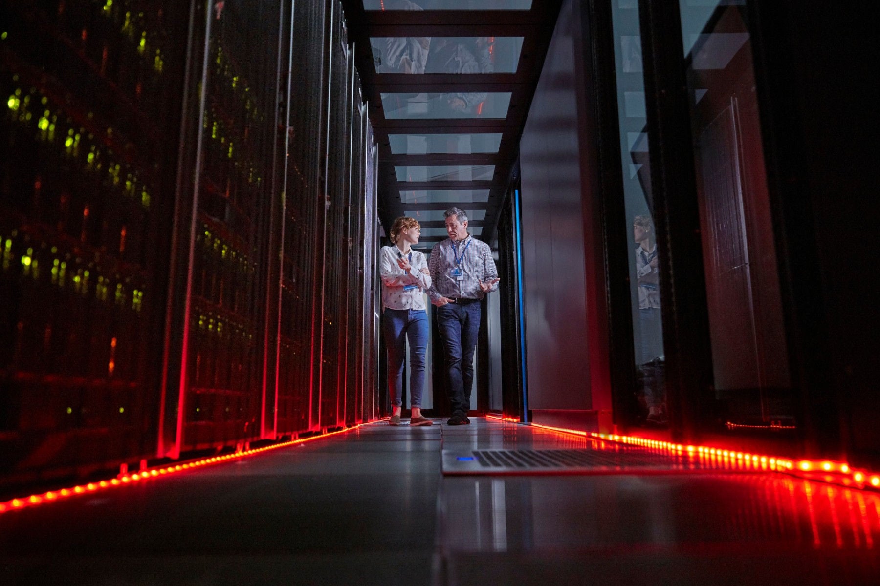 It technicians walking in server room