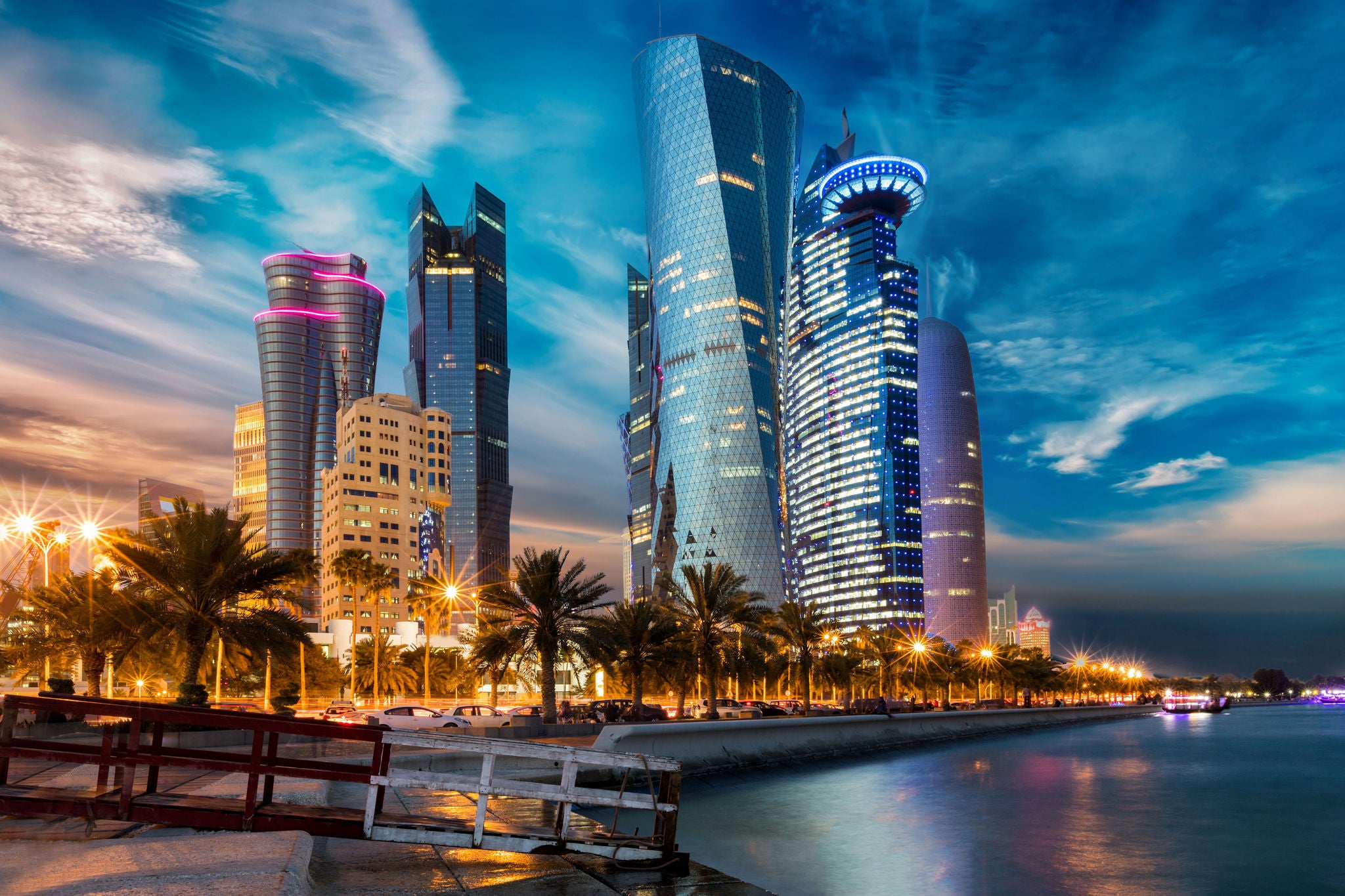 The skyline of Doha city center after sunset, Qatar