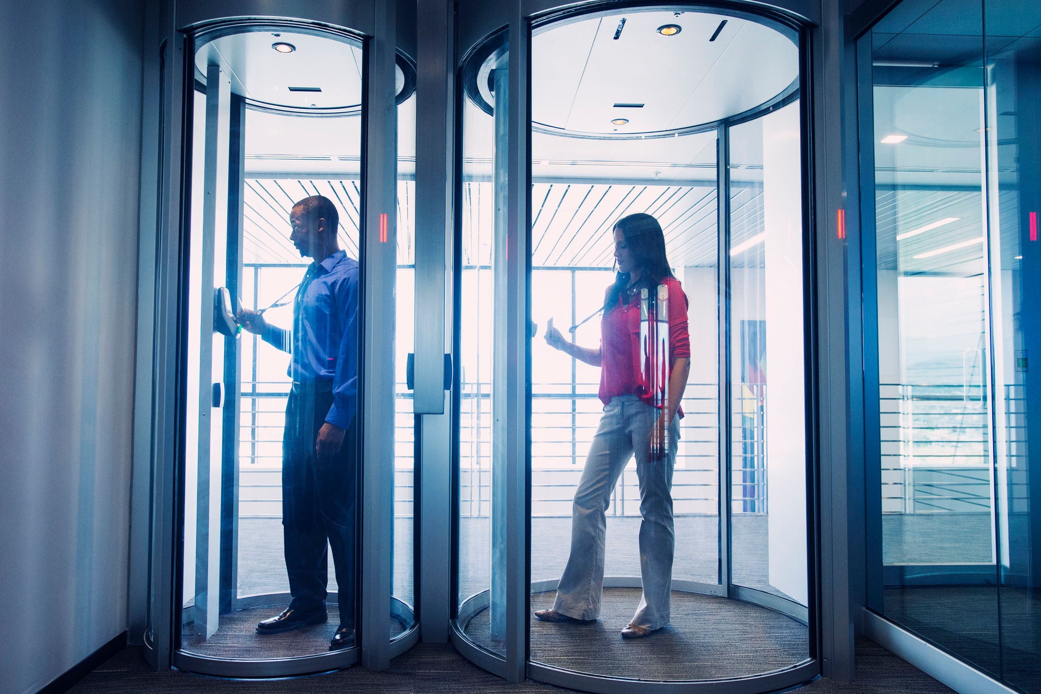 Business people using fingerprint lock system in office