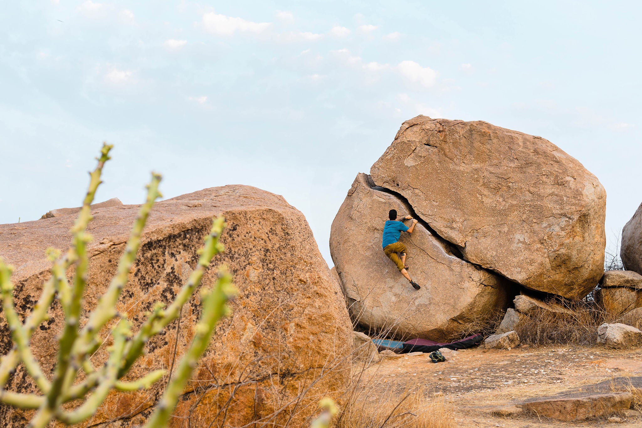 ey-man-boulderer-in-karnataka-india-background