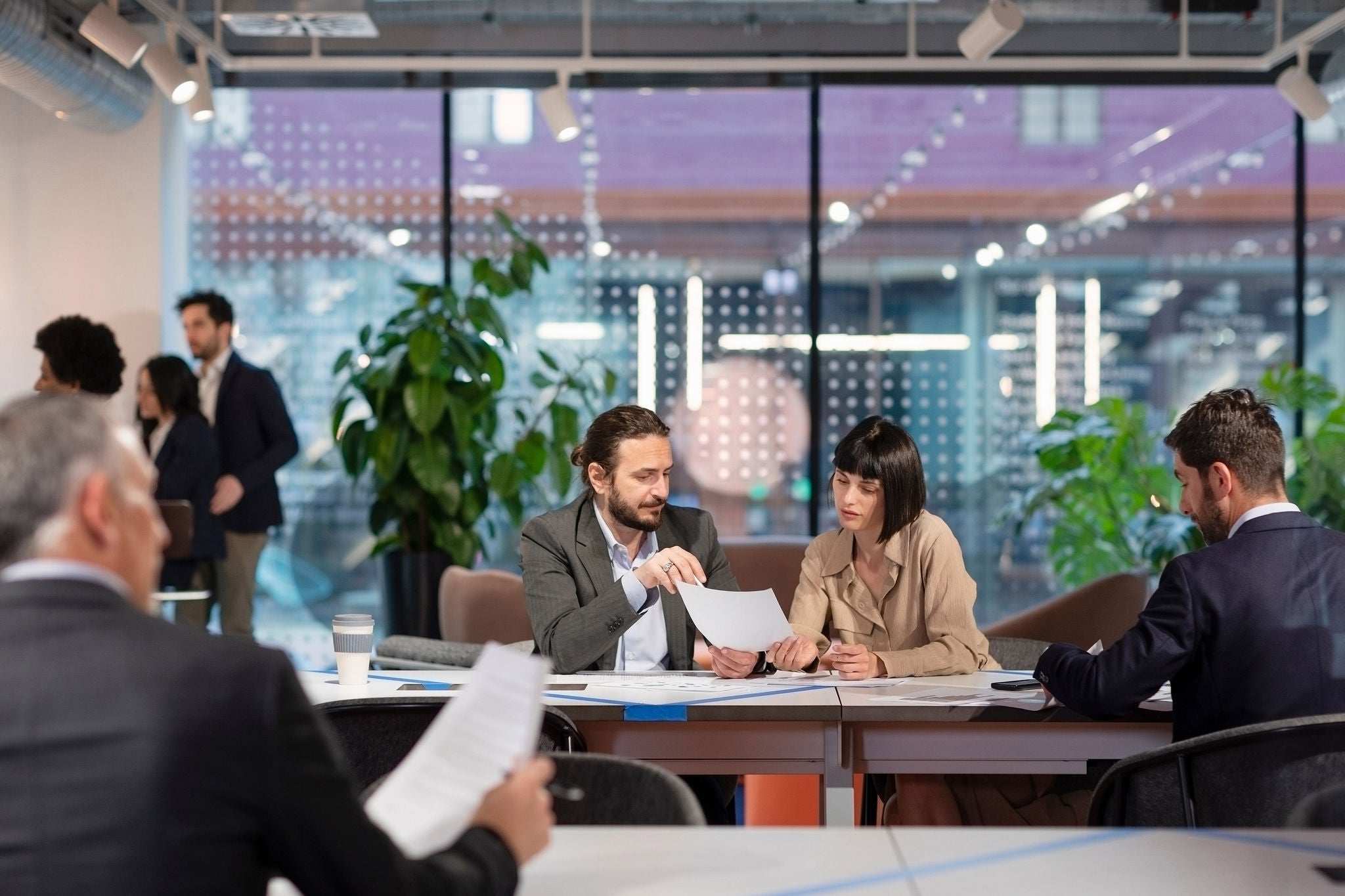 Business people working on documents in coworking space