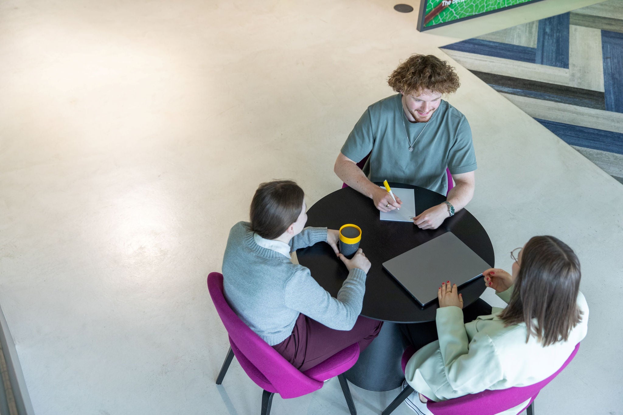 Three colleagues discussing 