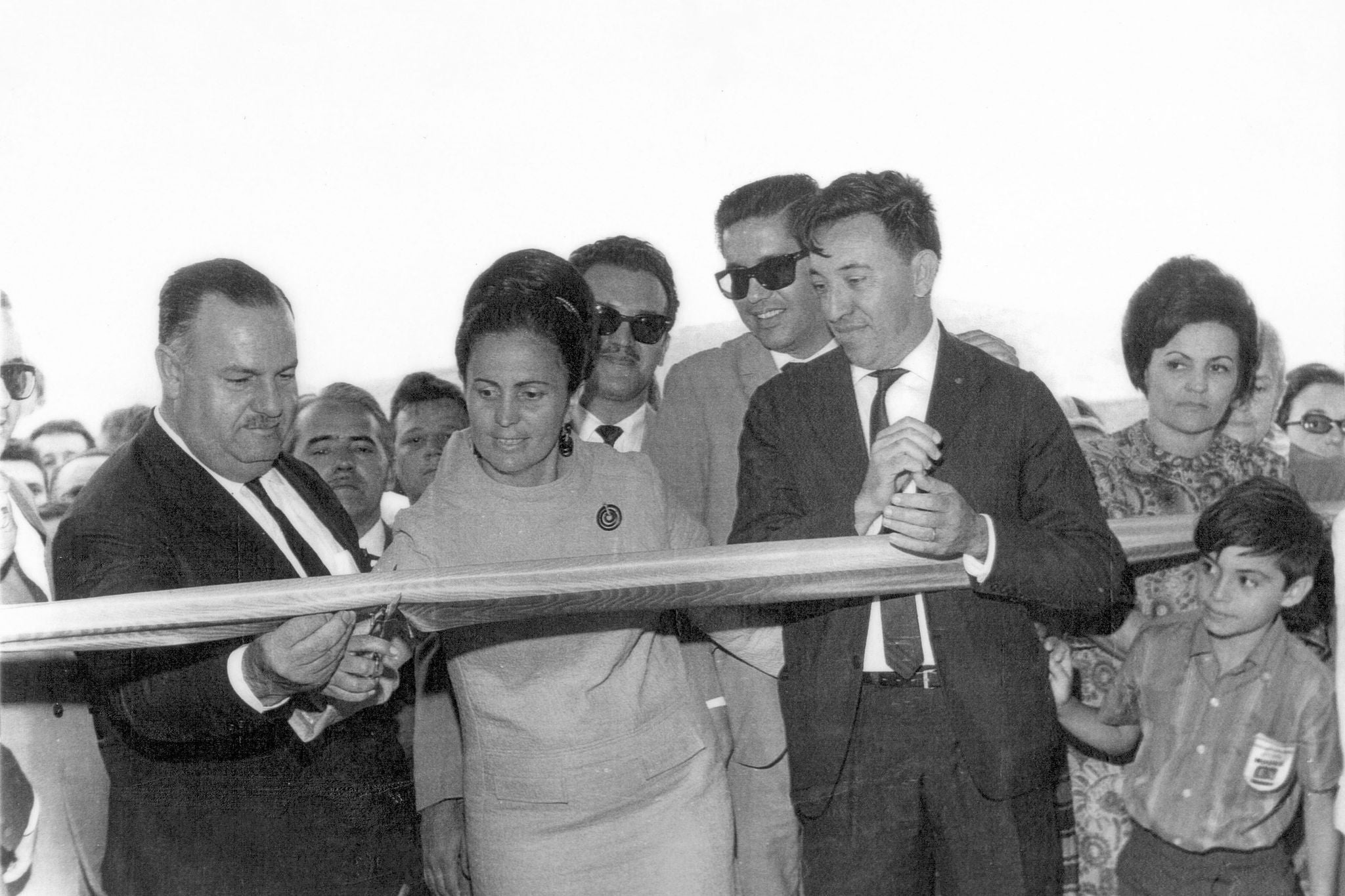 an archive photo shows the Moura family cutting the ribbon to open their new factory