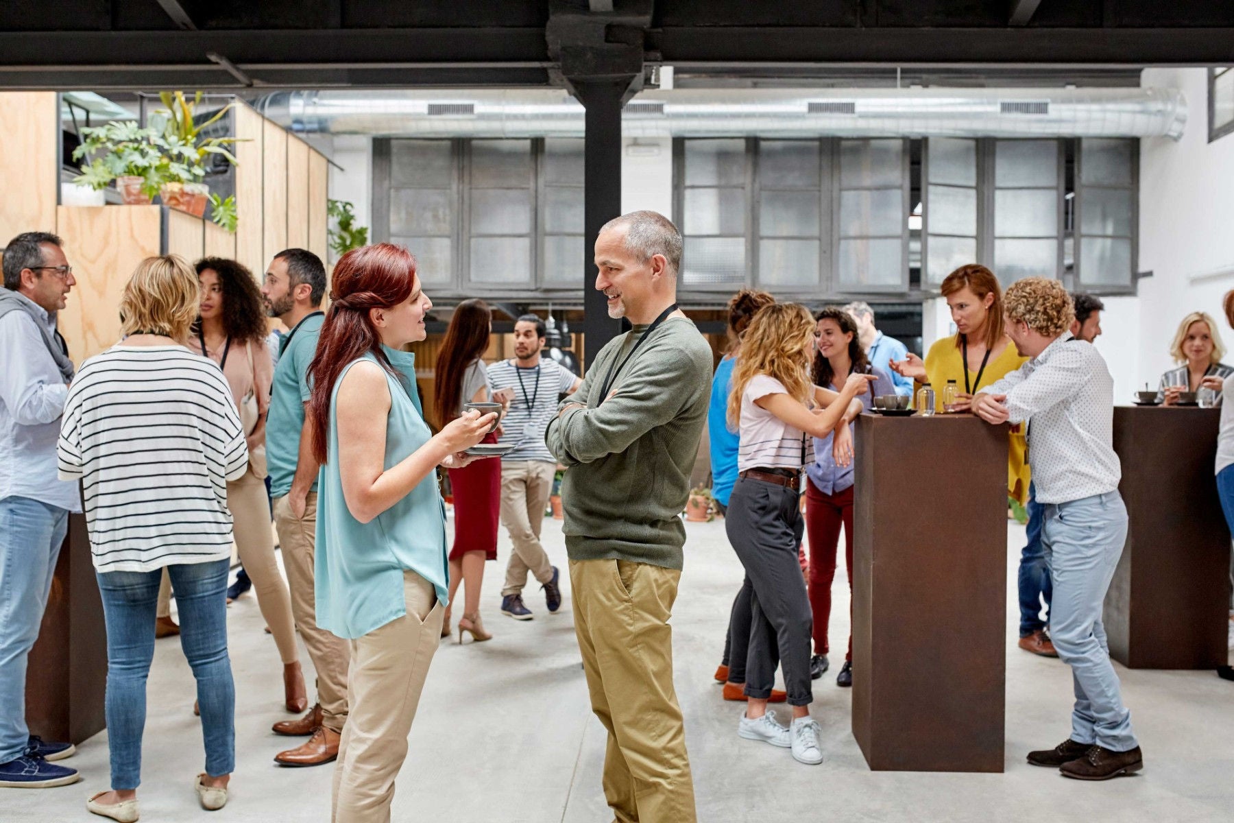 Ey people standing and discussing