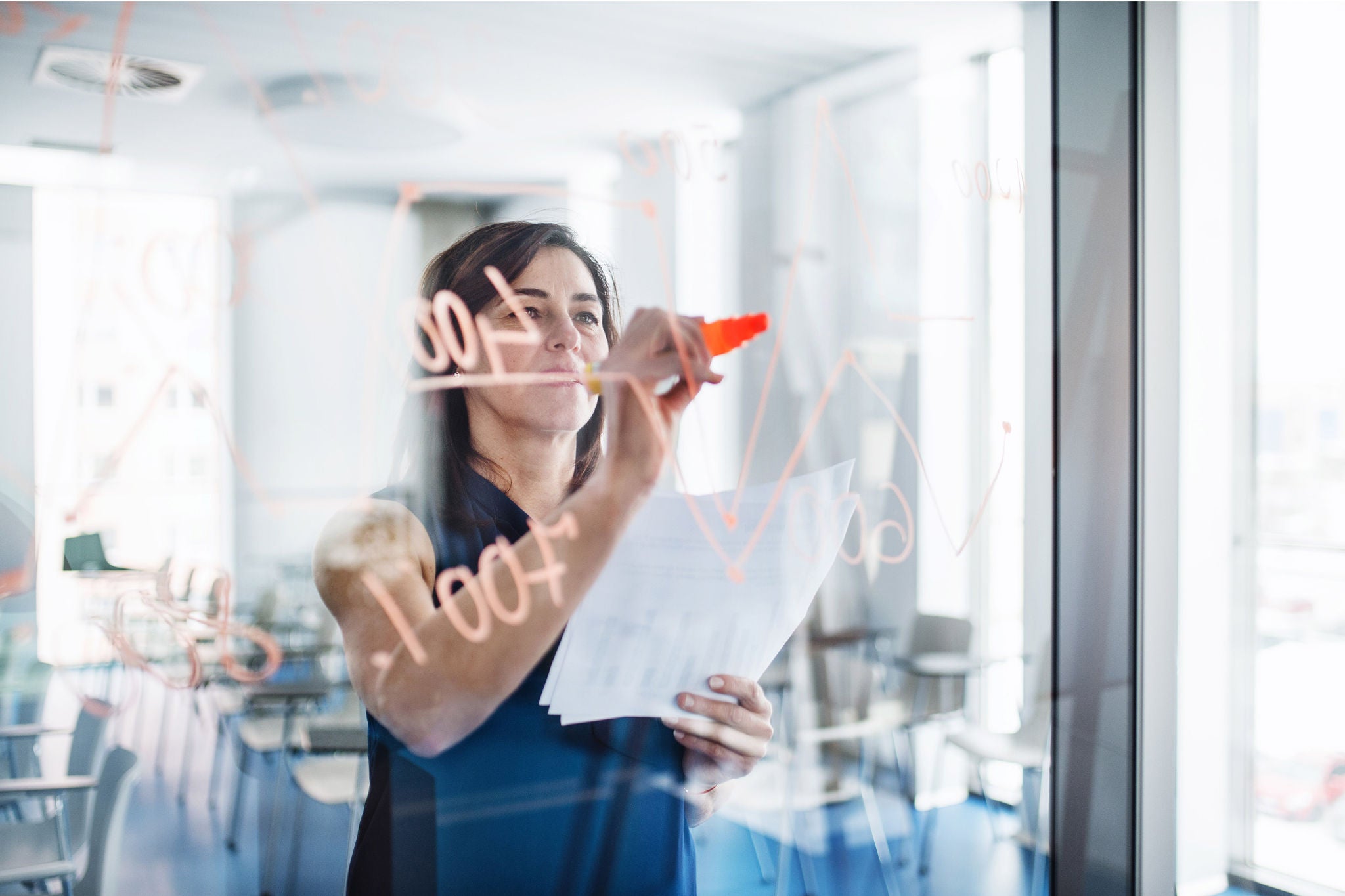 ey business woman writing 