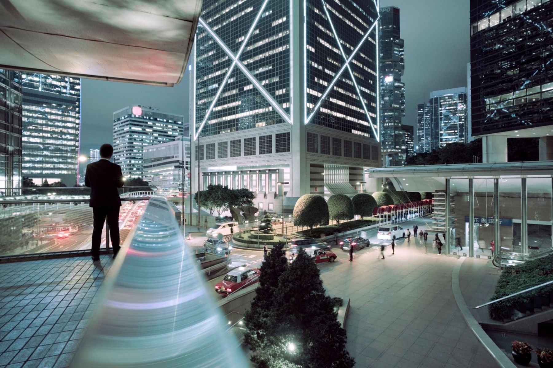 man-viewing-the-skyscraper-at-night