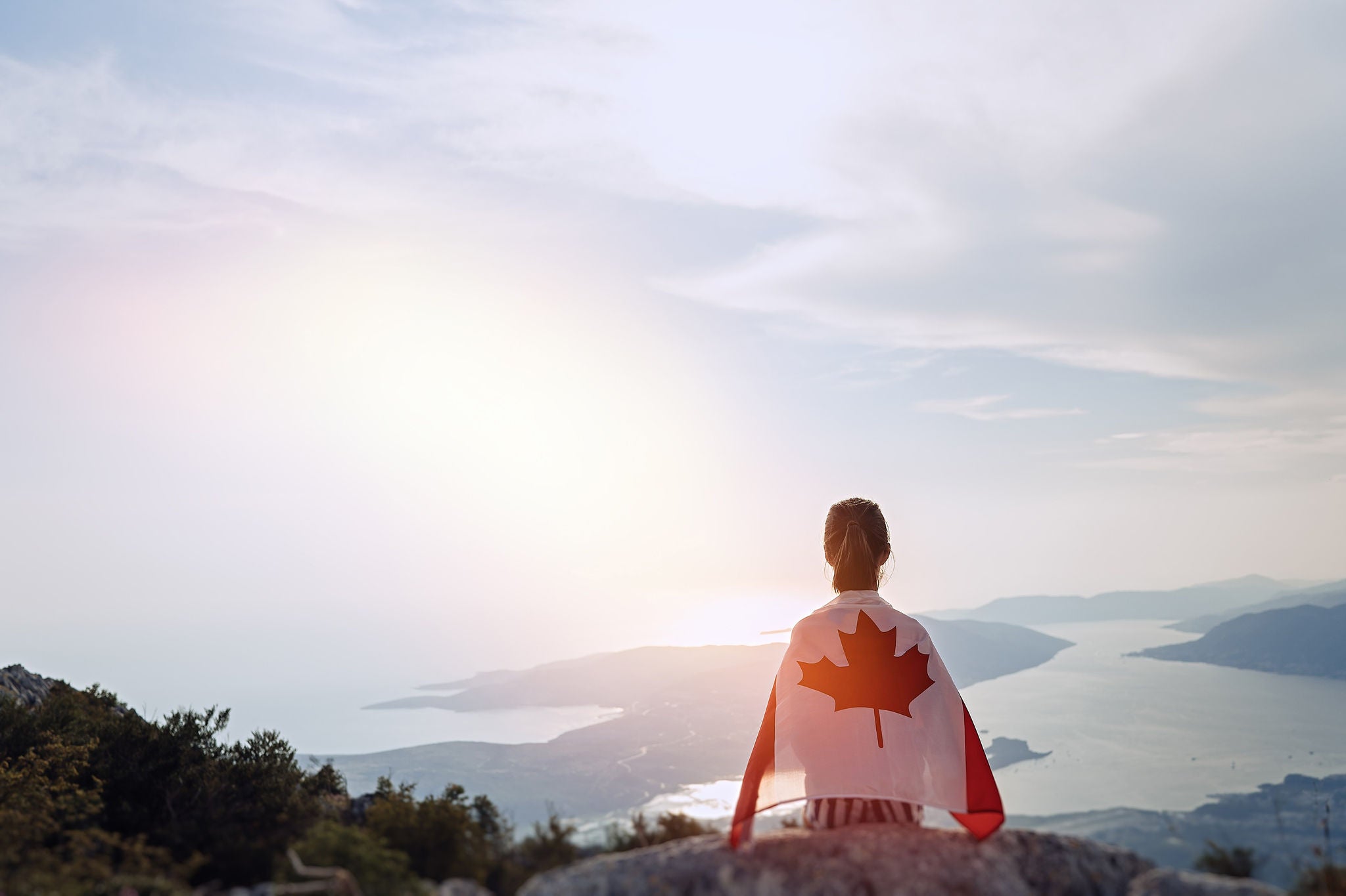 Wrapped in canada flag on the top of the mountain