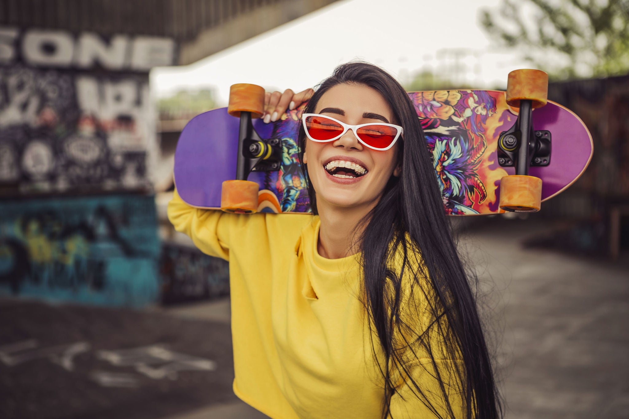 Woman in sport casual outfit in a skate park