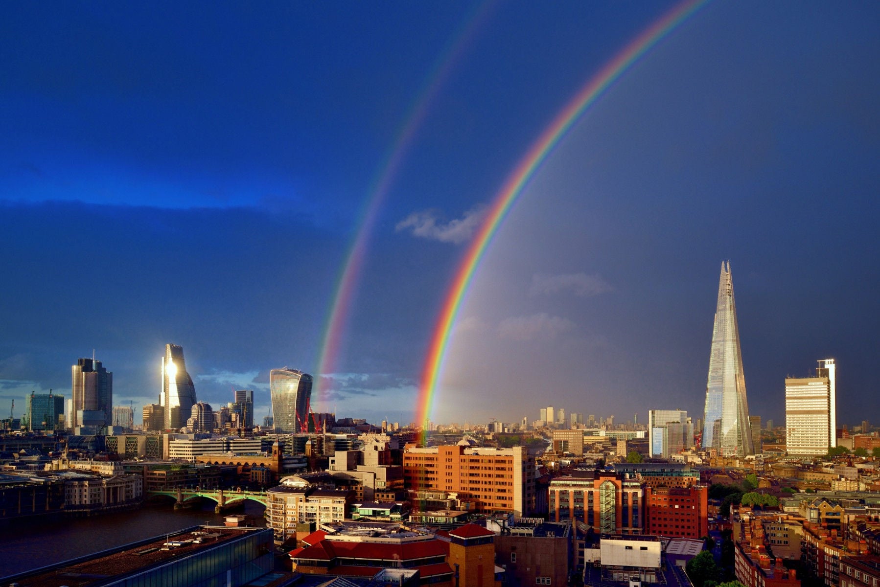 London cityscape with double rainbow