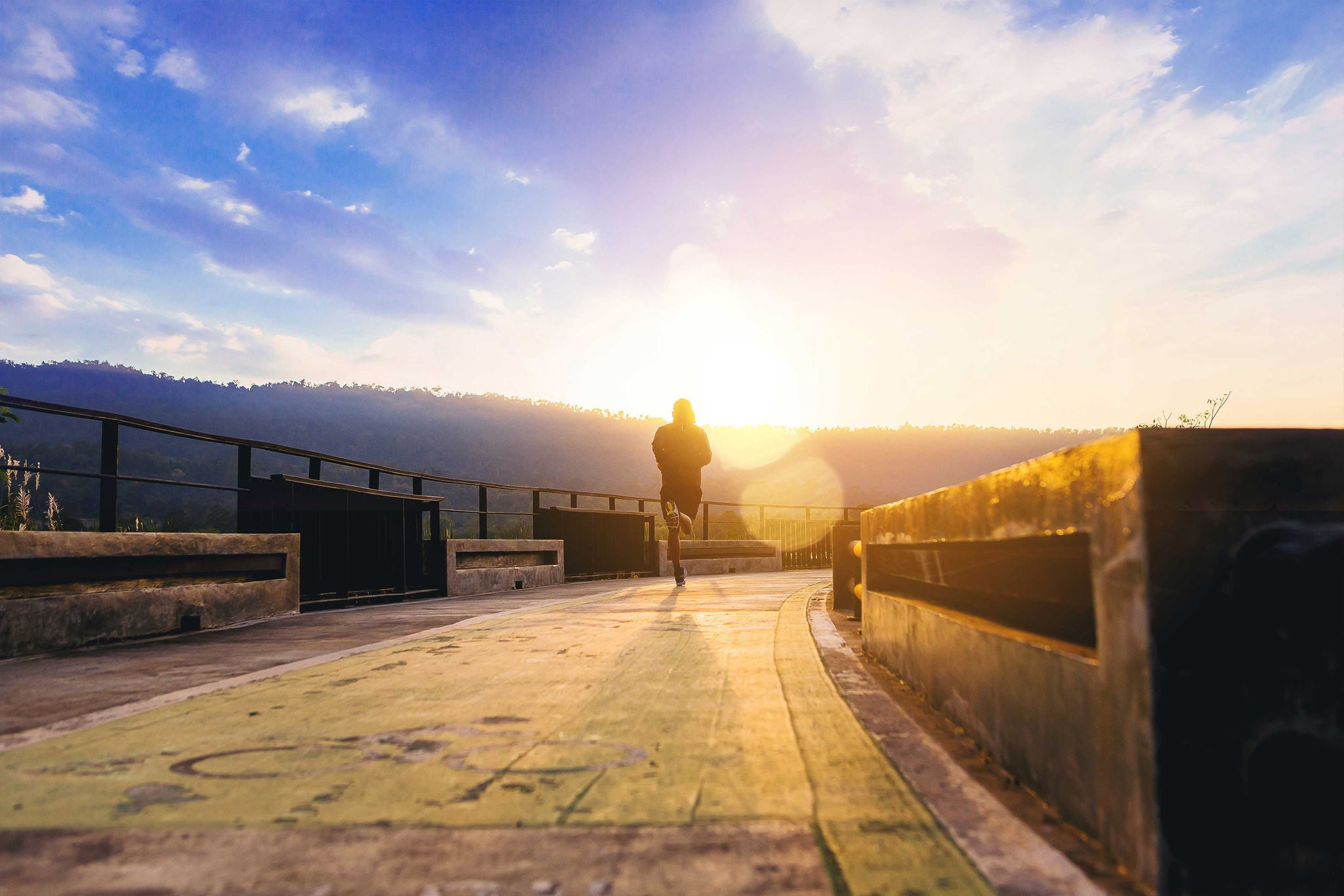 Man jogging on the walk way