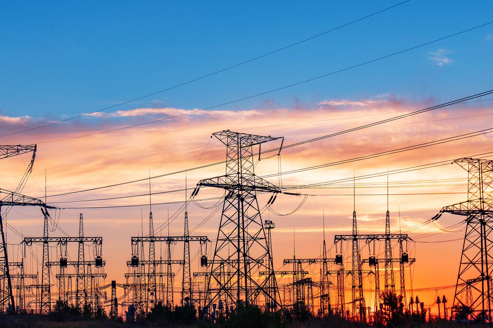 Electrical substation silhouette on the dramatic sunset background