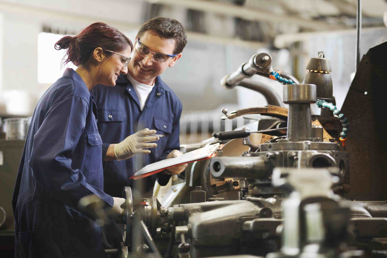 Engineer Teaching Female Apprentice