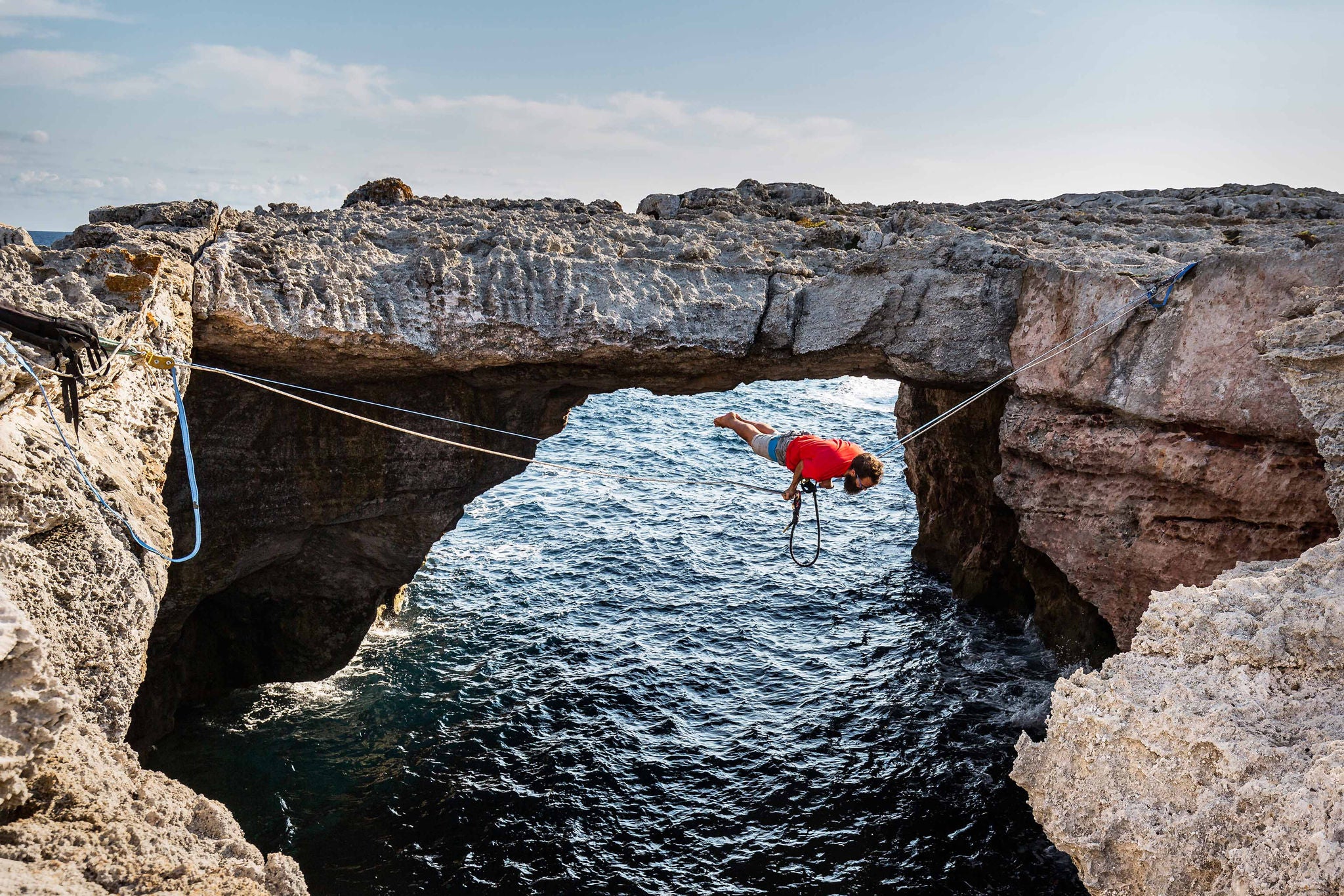 Man slack-lining over water