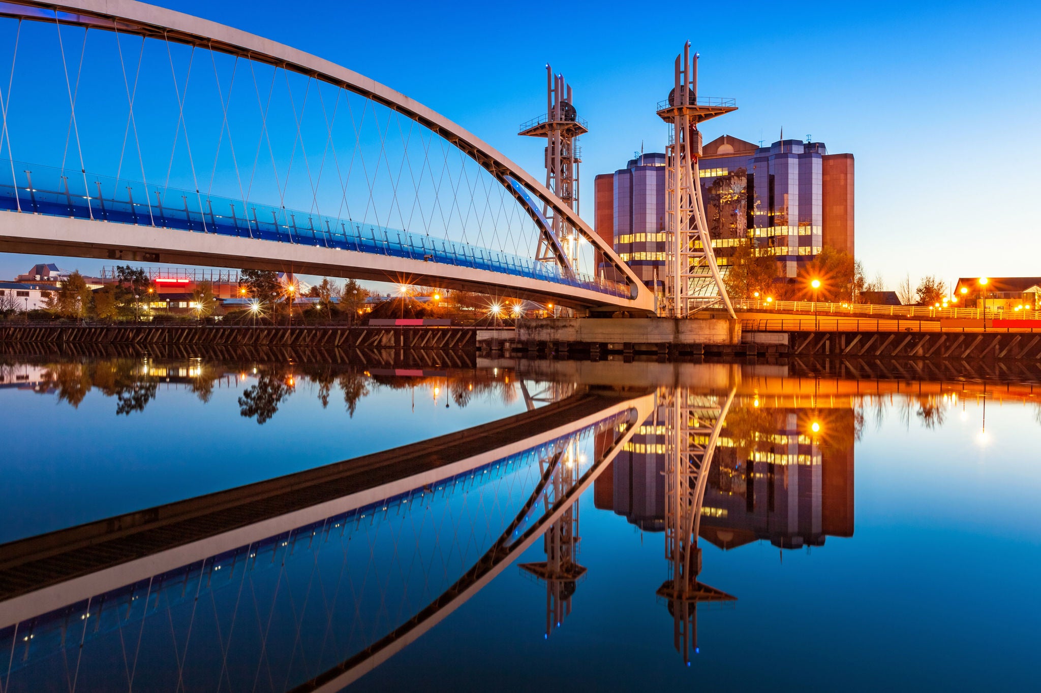 Stock Photo of the Millenium Bridge at Salford Quays in Manchester, England at twilight blue hour.