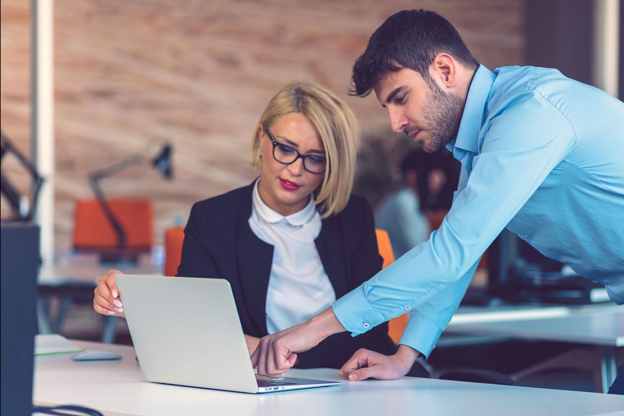 Man and woman working on the report