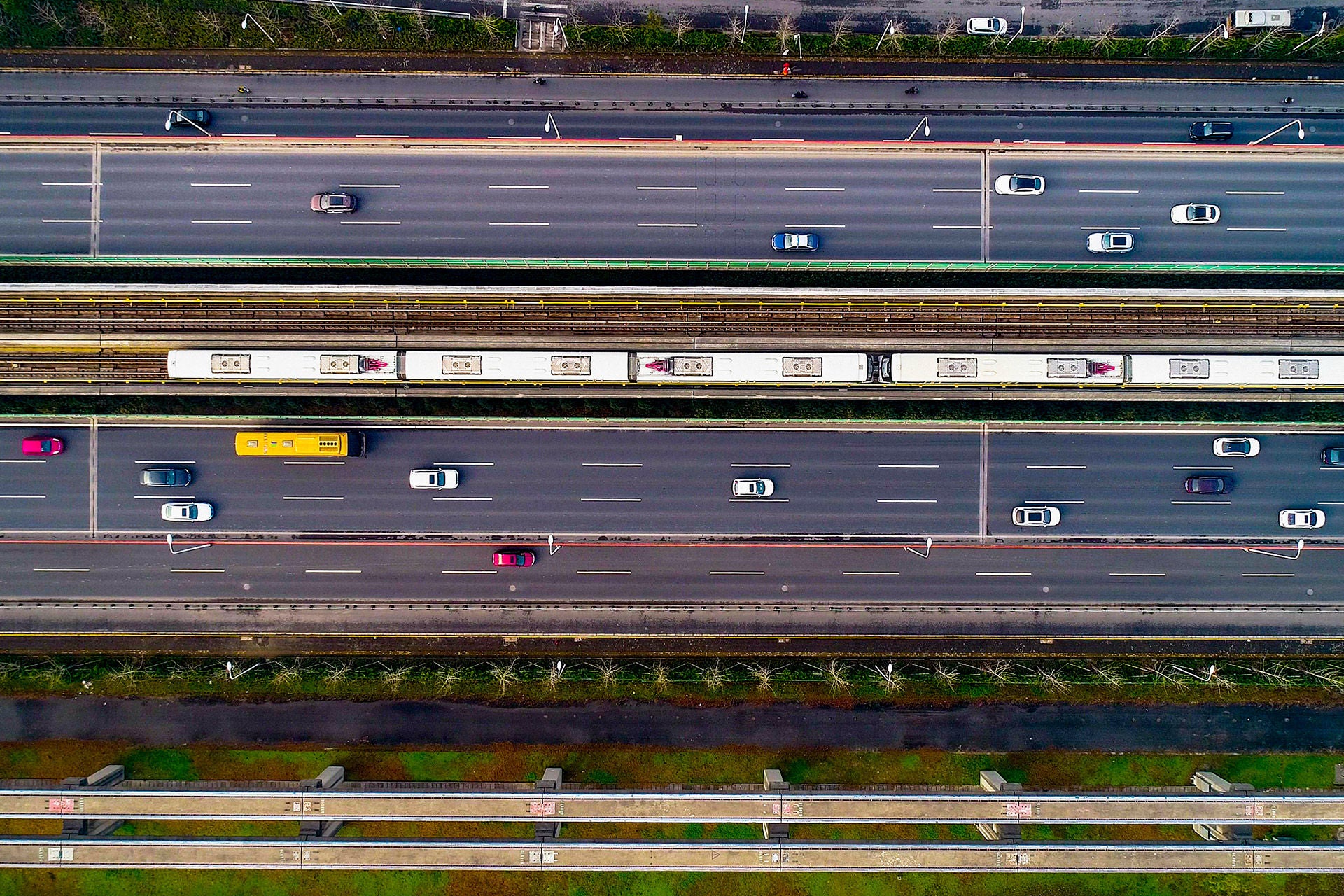 Aerial view of shanghai modern transportation: metro and car moving fast on the road