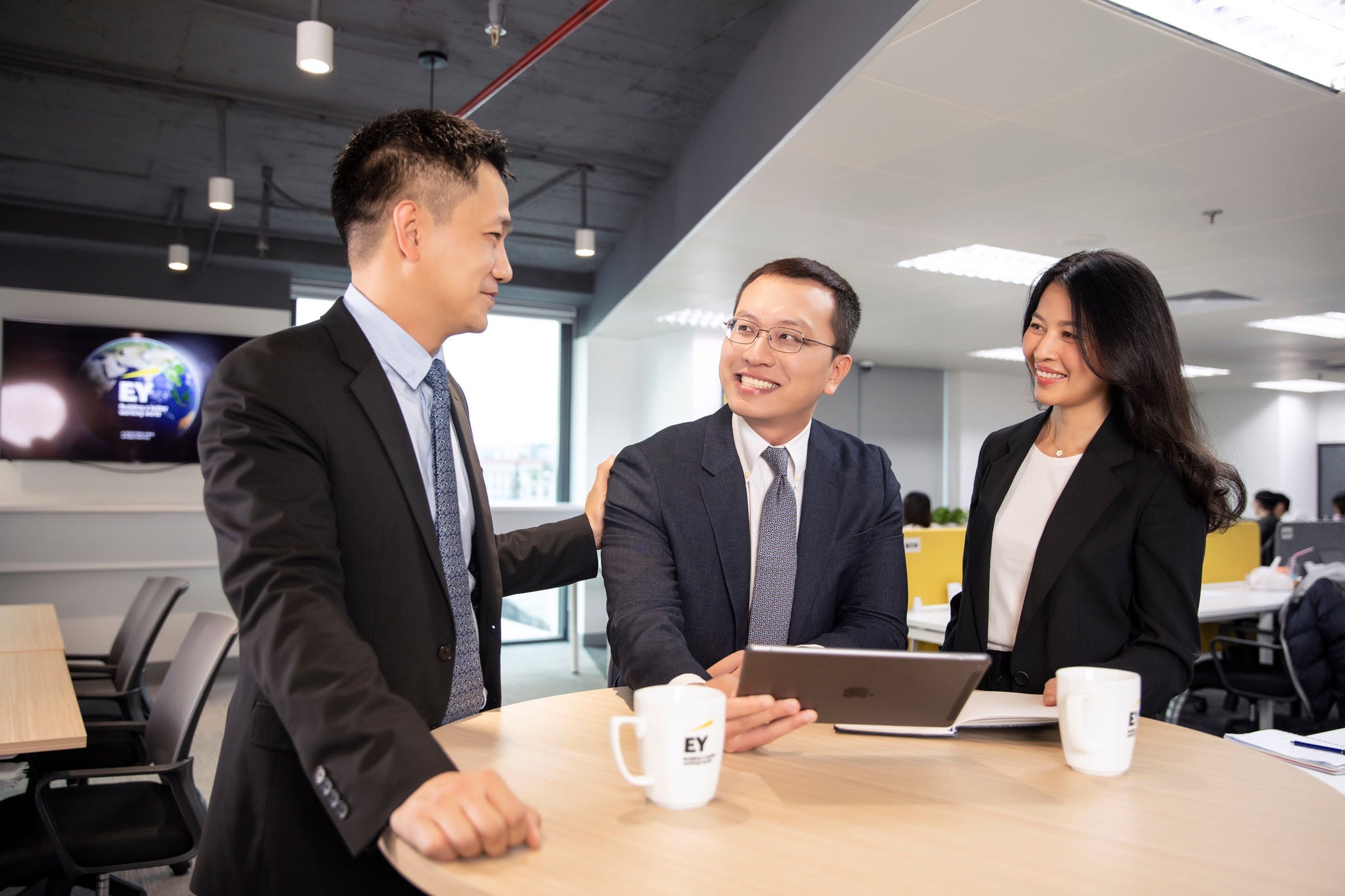 Employees talking in office