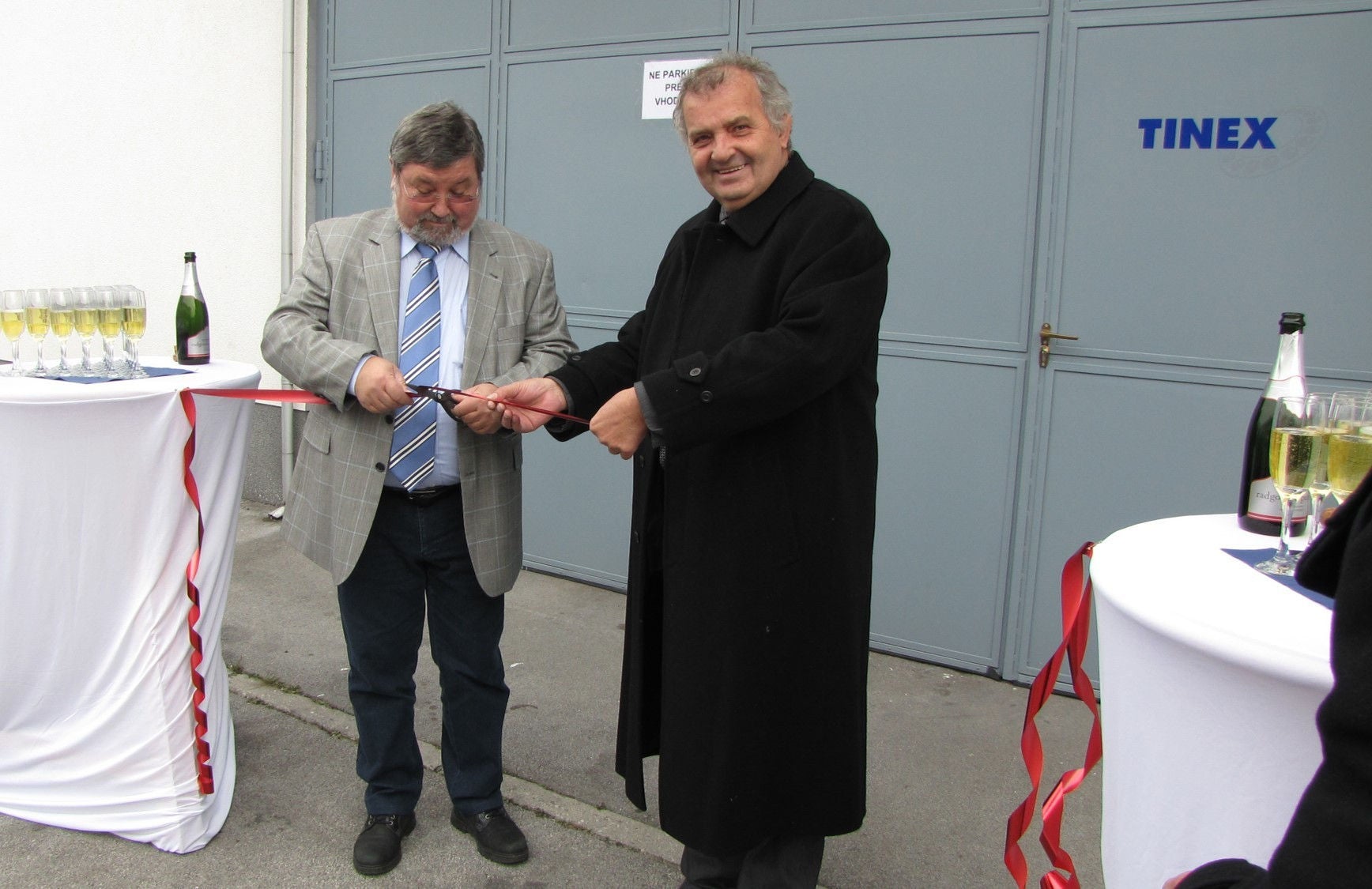 A man cutting the ribbon