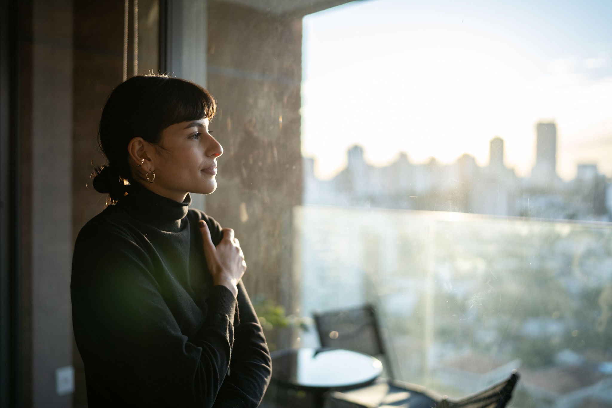 Woman looking outside the window