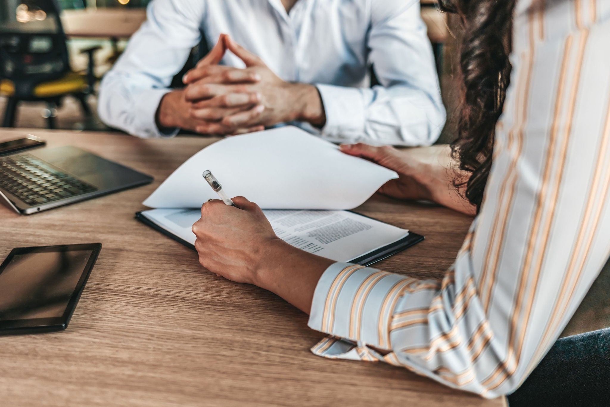  Business people negotiating a contract