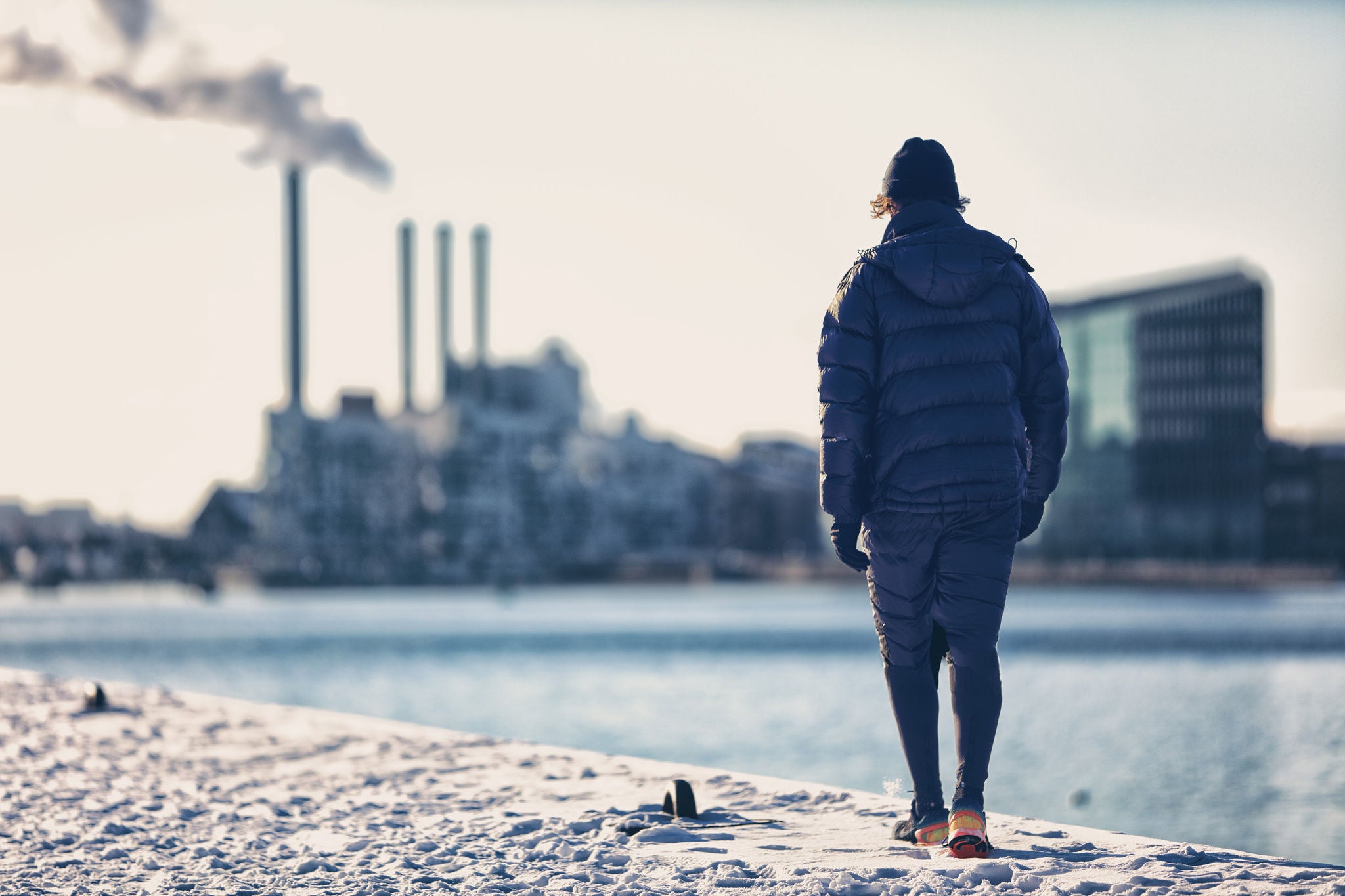 Winter city smog pollution people walking in warm outerwear in cold morning commute