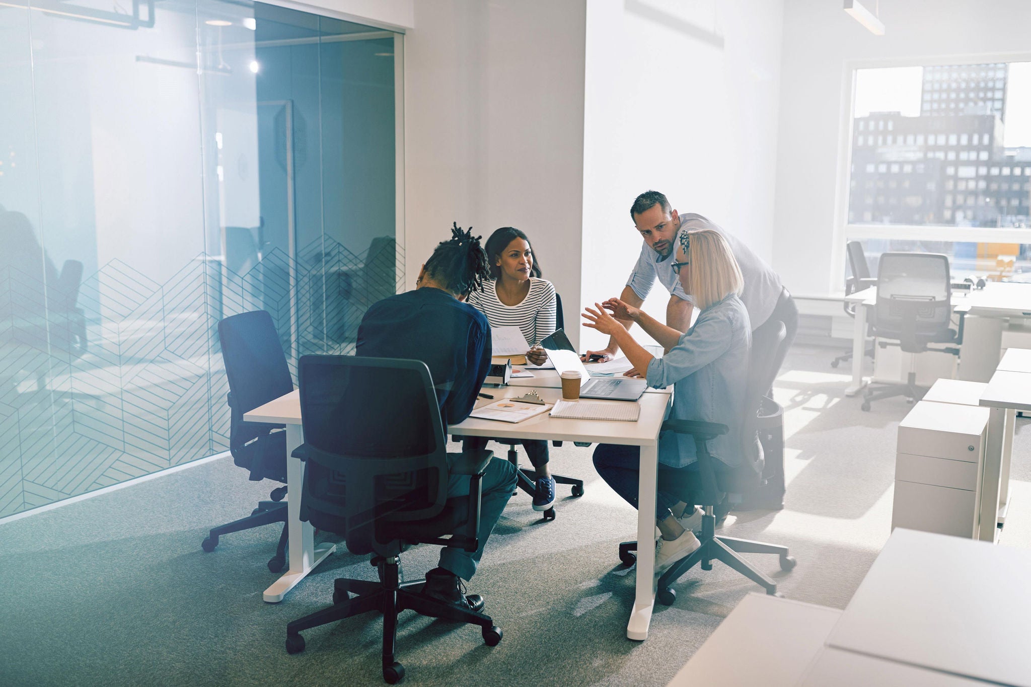 Diverse work colleagues in an office meeting