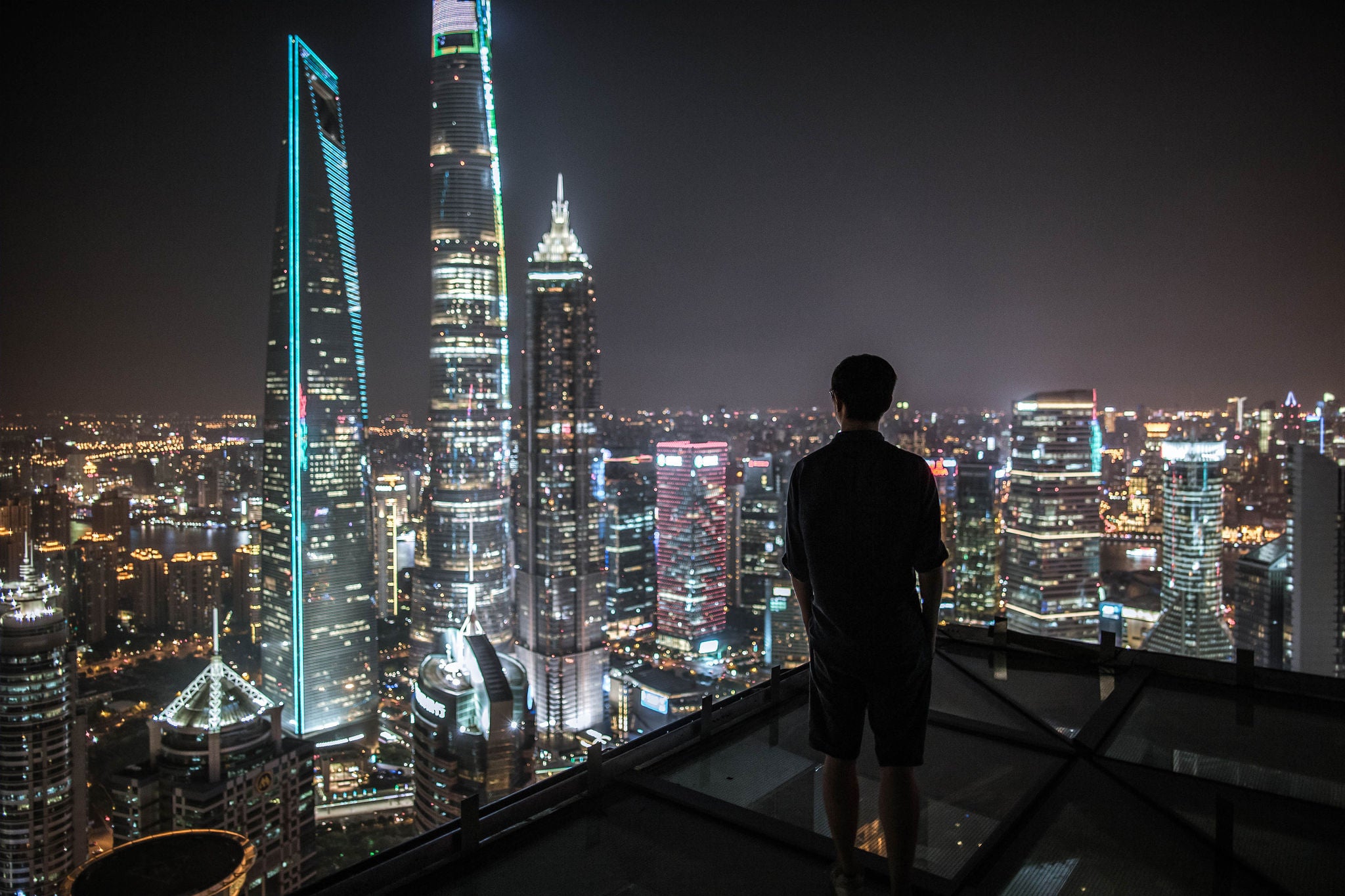 Man top of the building and watching the view