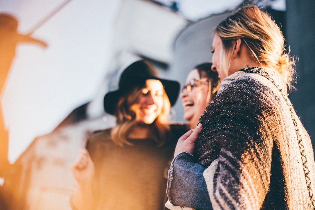 Three womens are laughing in the photograph