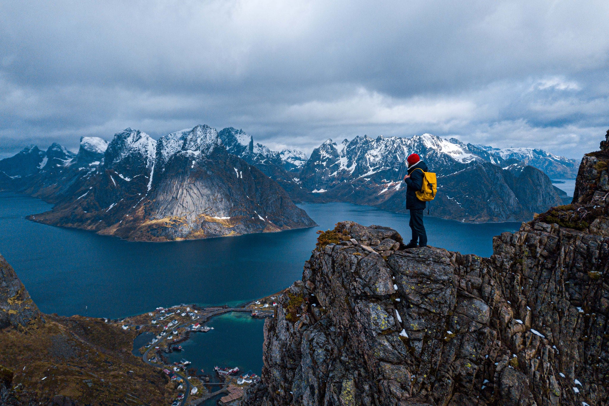 A Man enjoying the sunset on the mountain