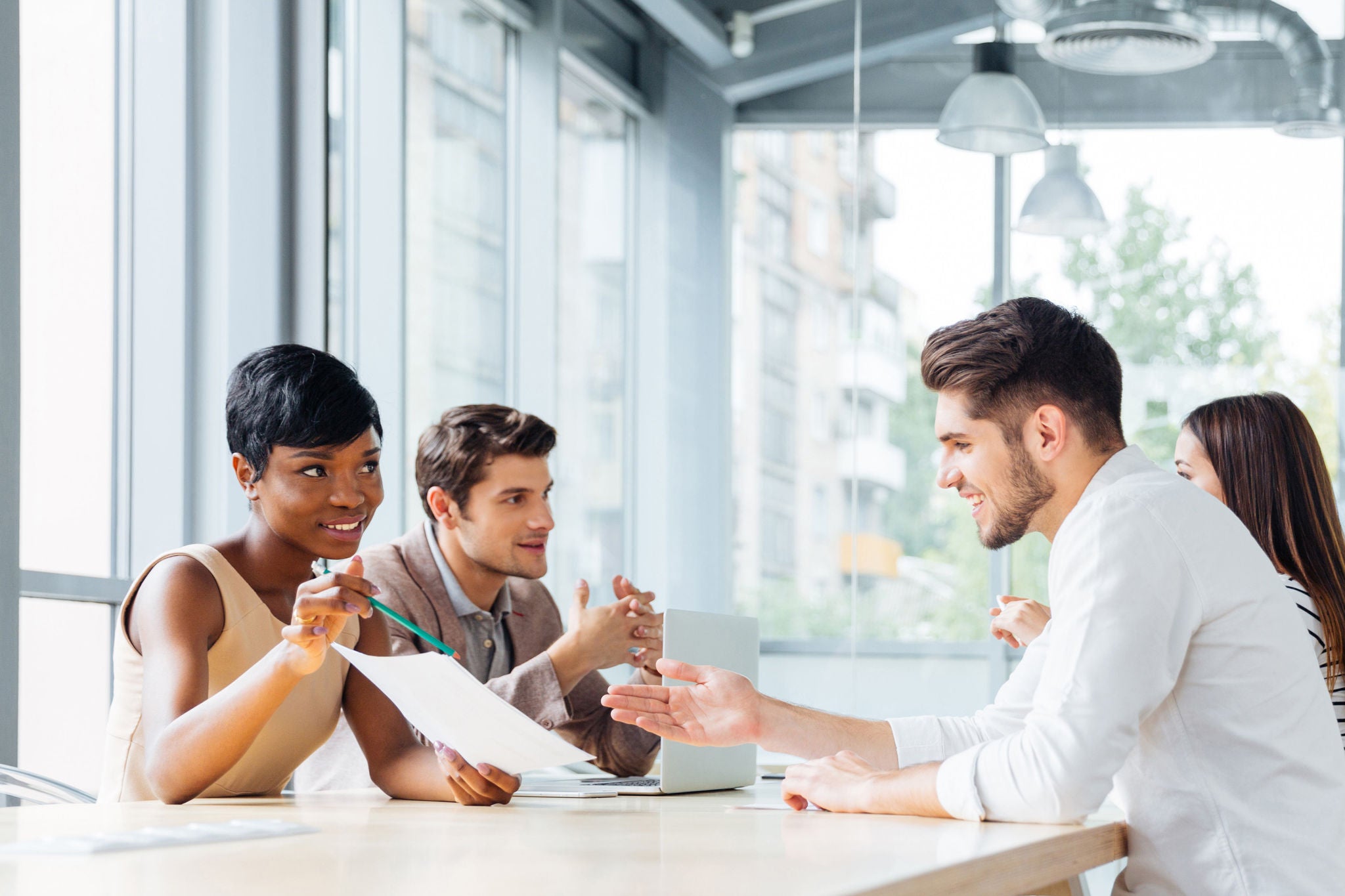 Business people discussing new project at business meeting in office