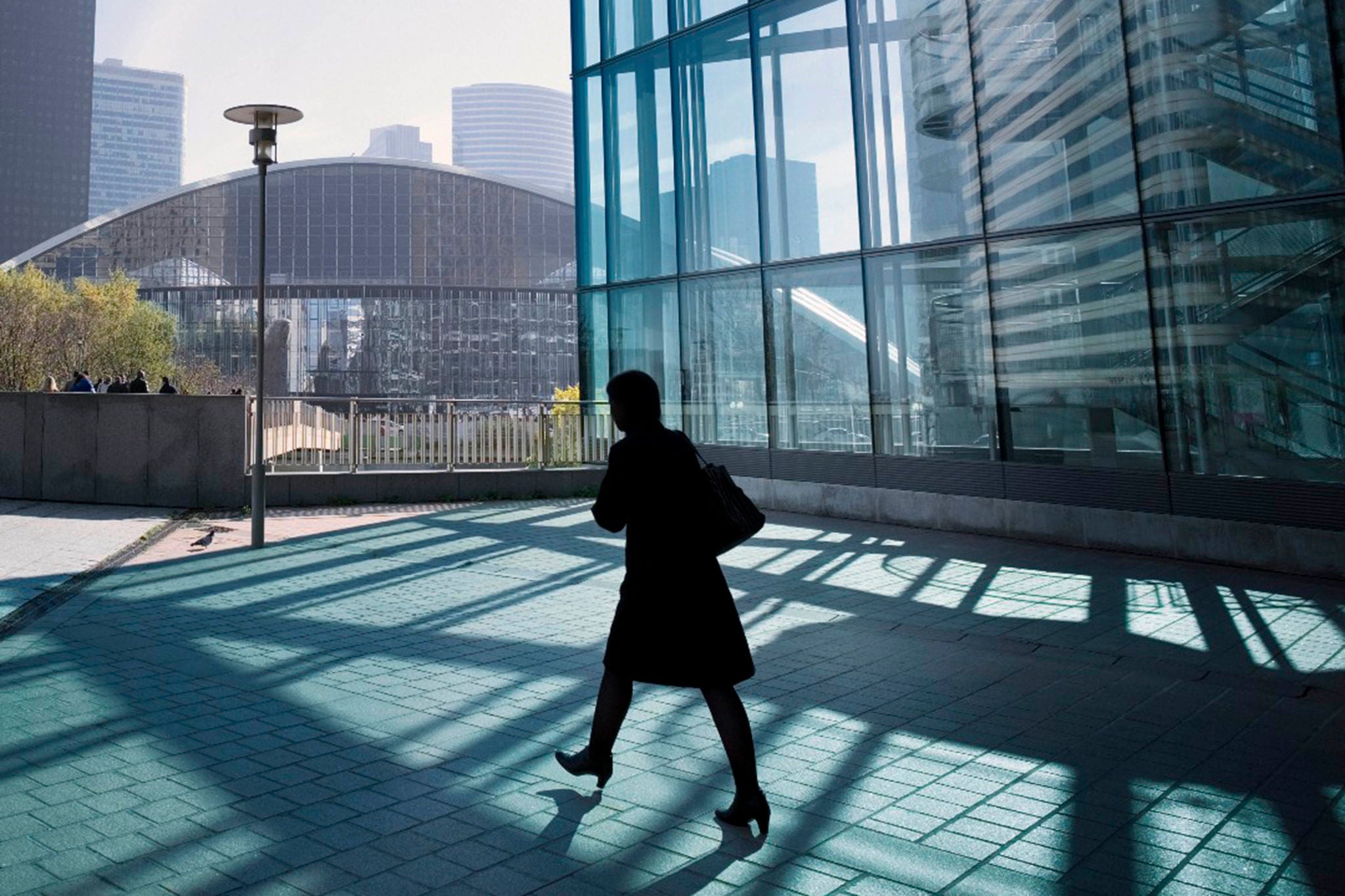 Woman walking with high riser in backgrounds