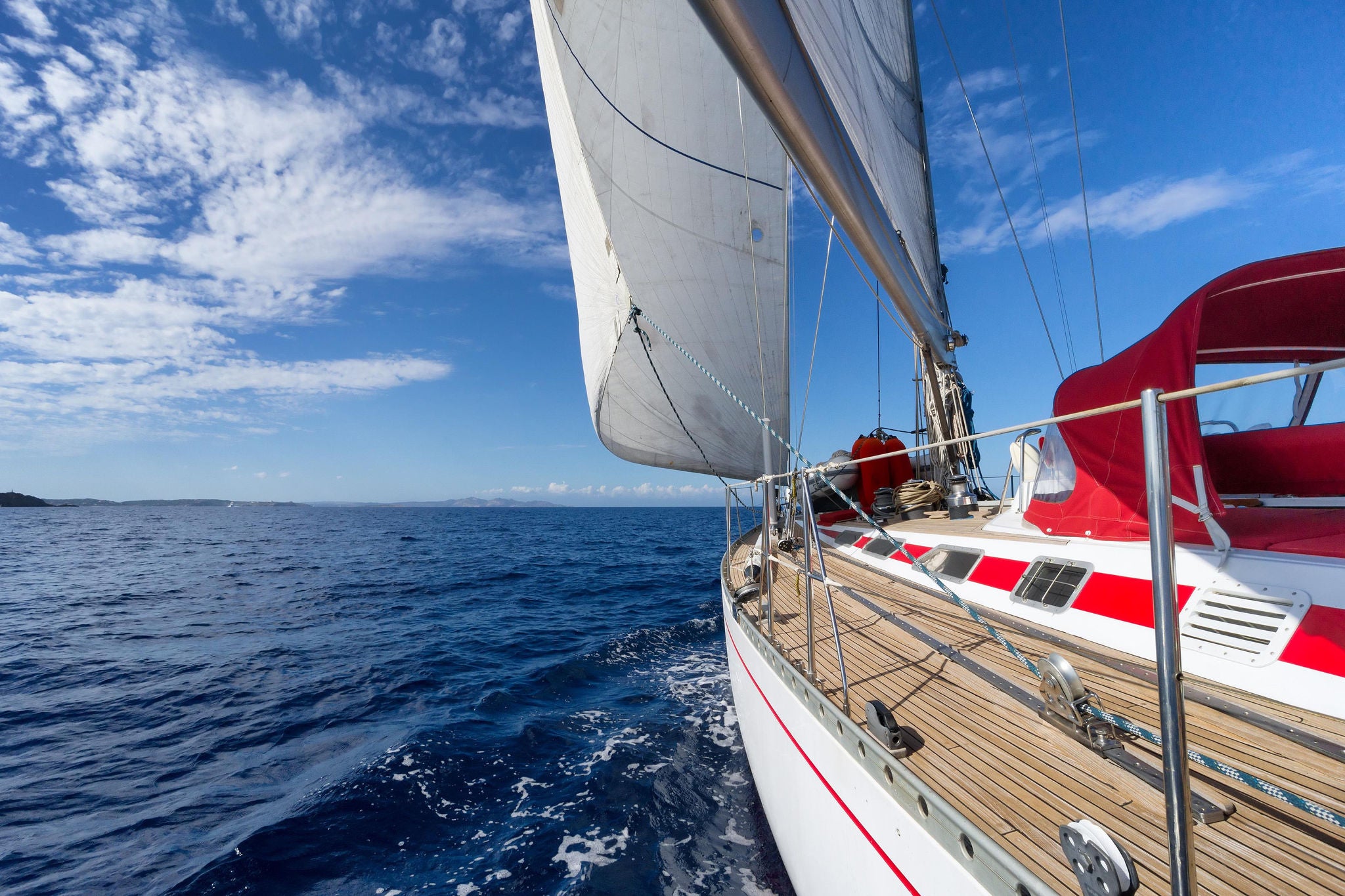 Yacht sailing in the sea in sunny day