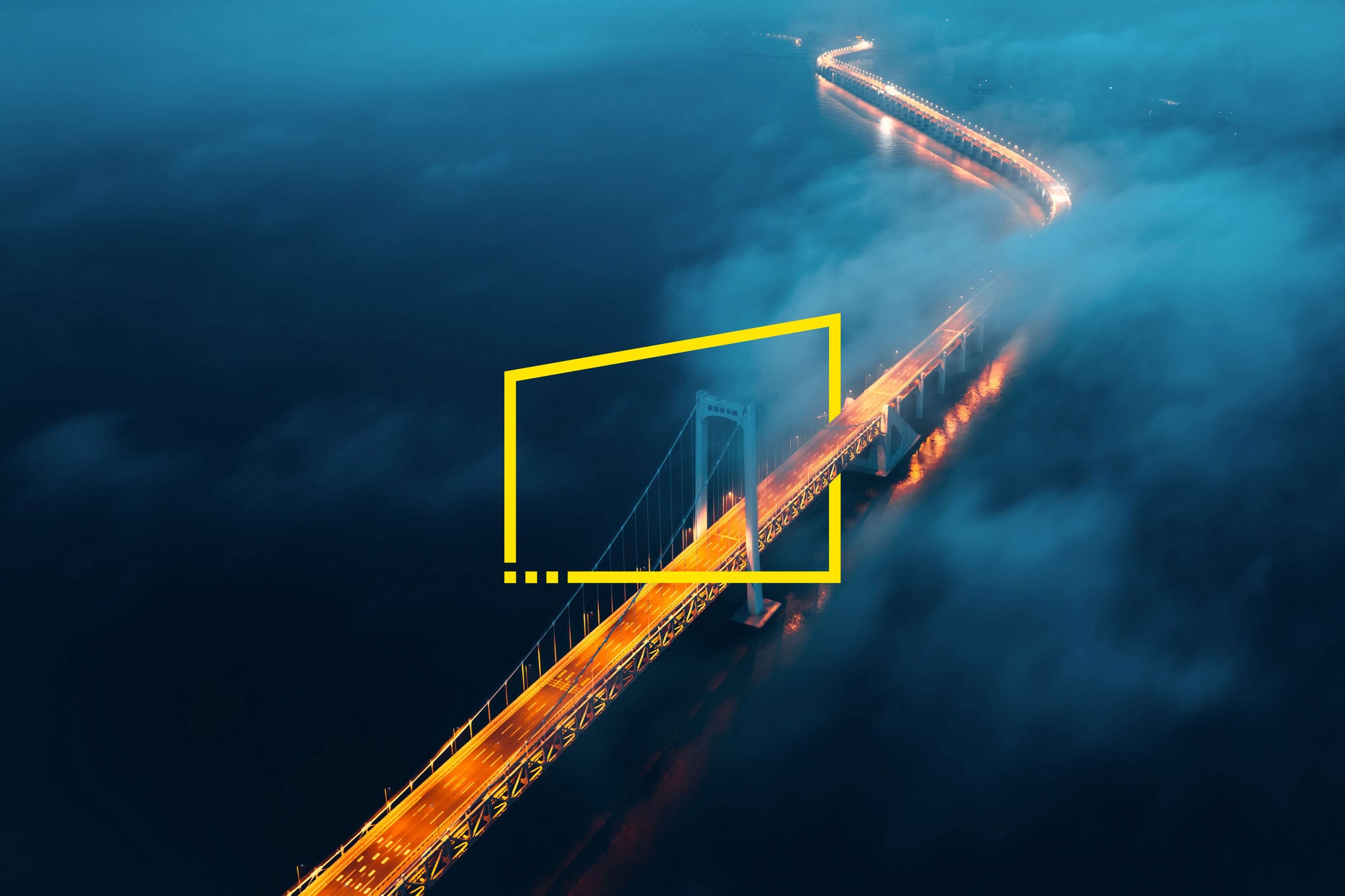 A cross-sea bridge in the fog at night