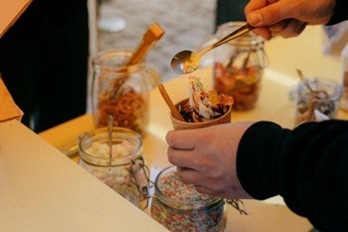 A man mixing some eatable items in a glass