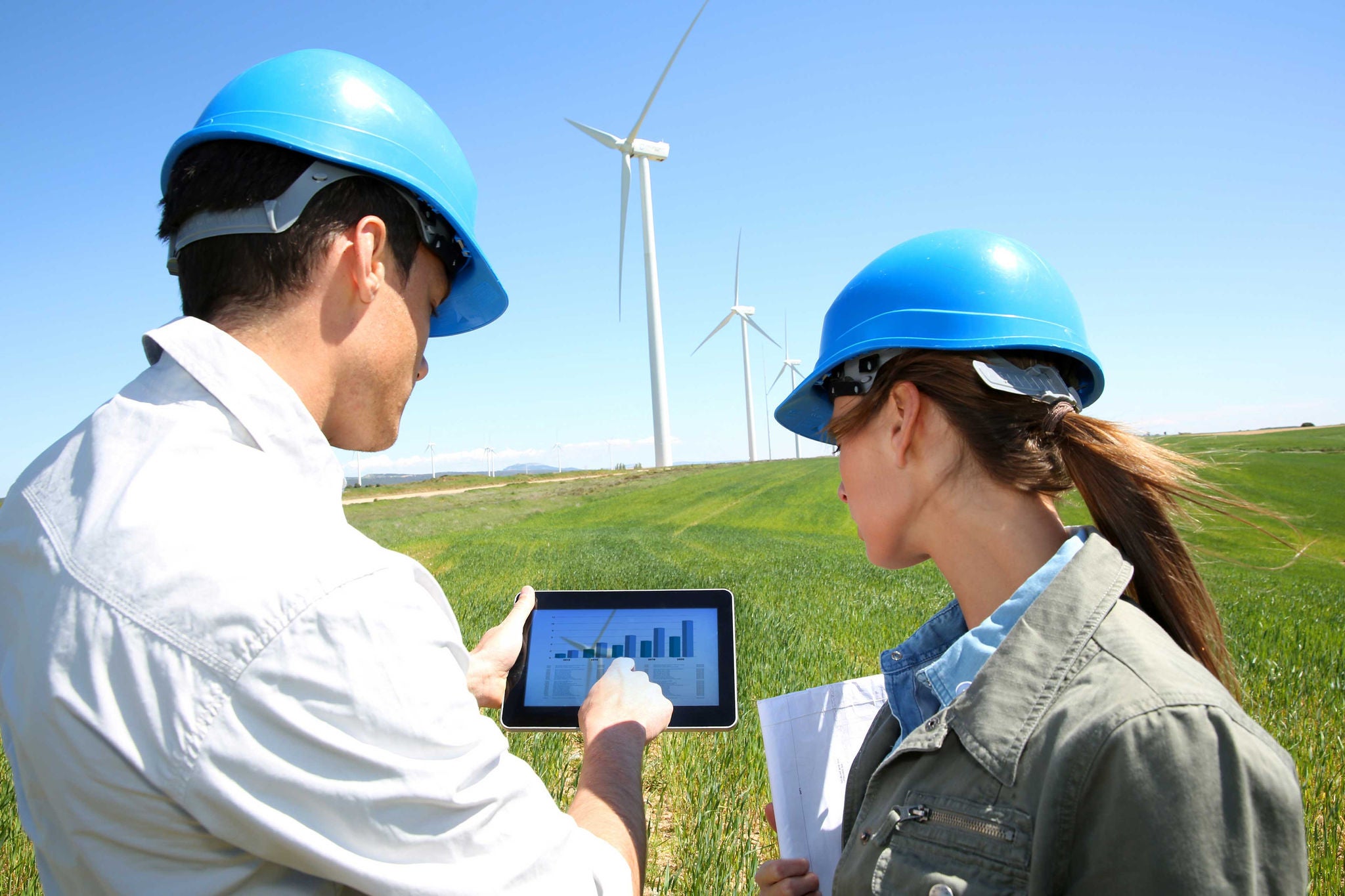 Man and woman discussing environmental plan