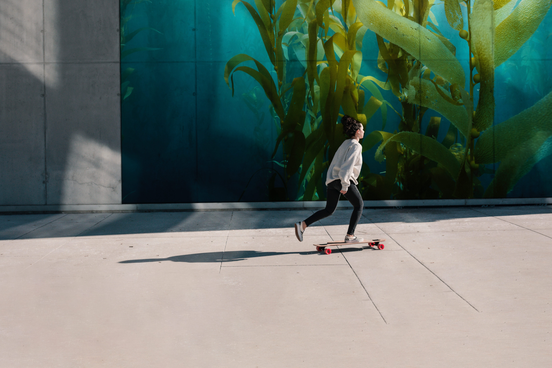 Young woman on longboard