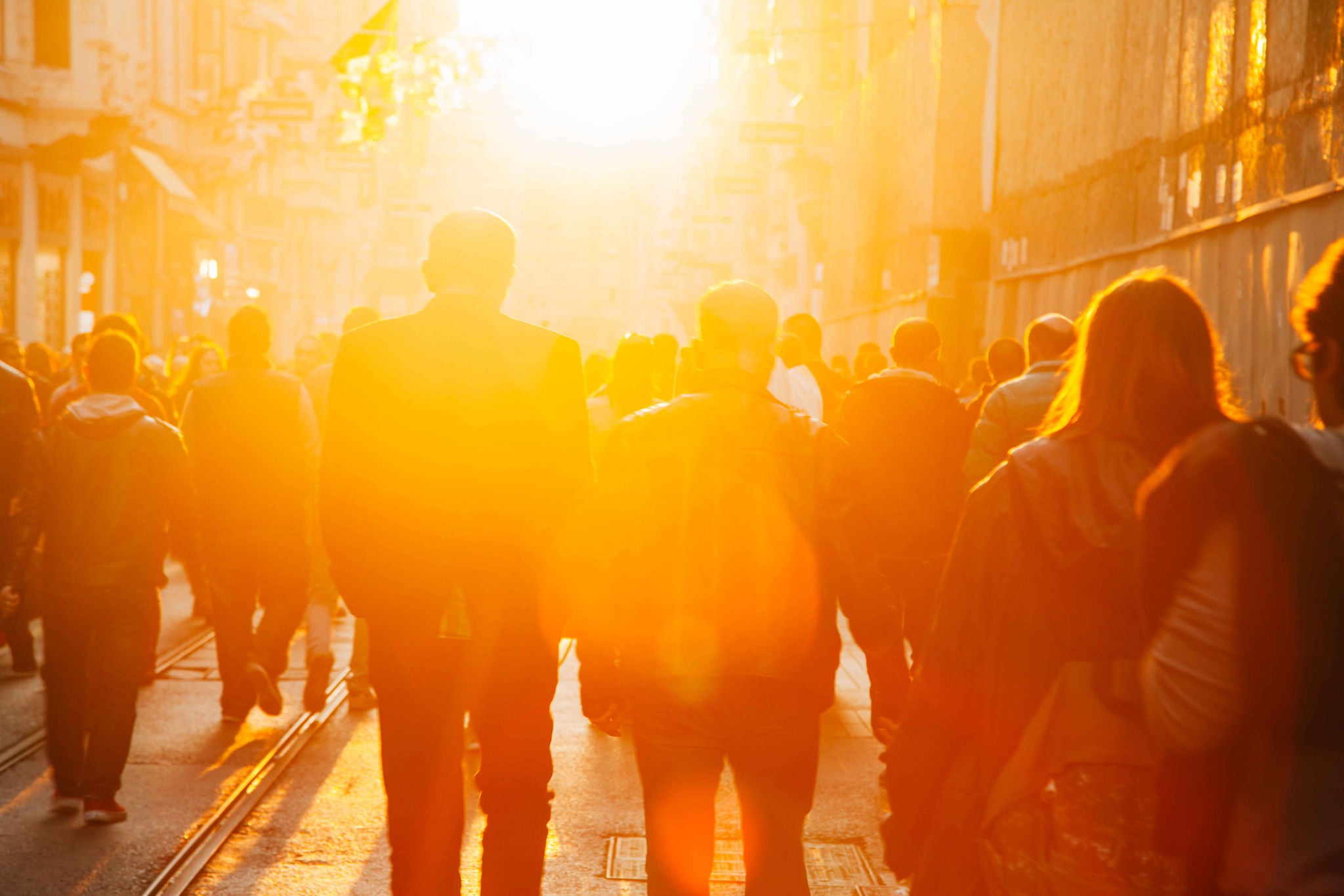 Crowded pedestrian walking on Istiklal street on sunny day with sunflare in Taksim, Beyo?lu, Istanbul, Turkey