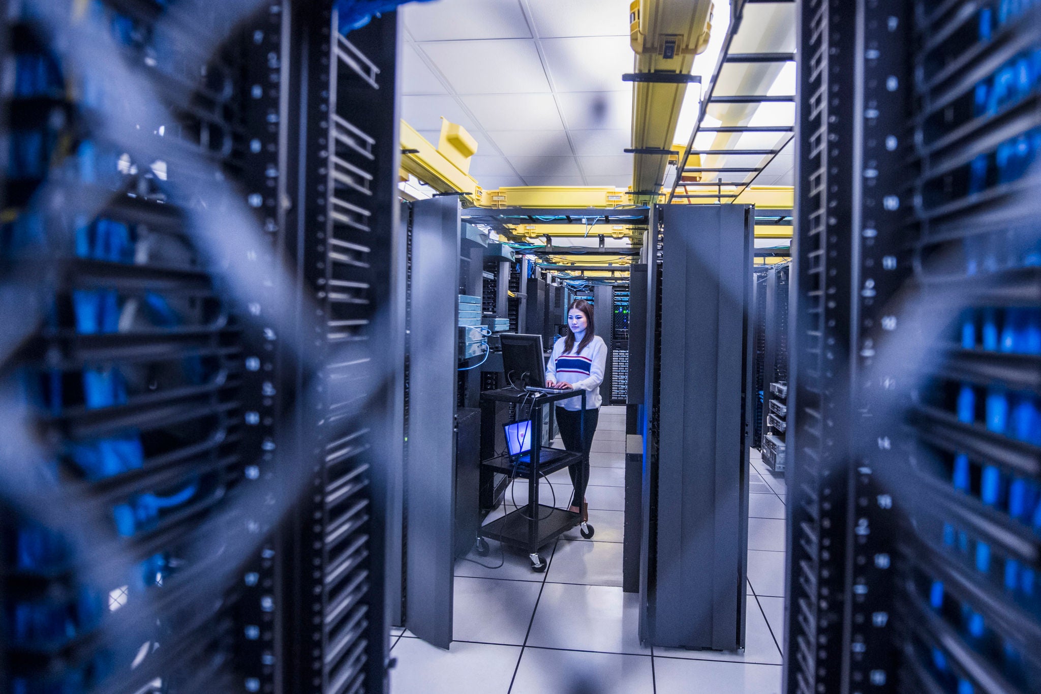 woman working at computer server room