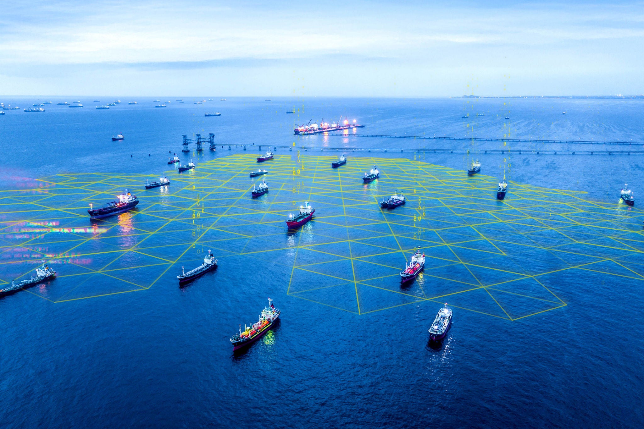 Aerial view oil tanker and gas tanker loading in port in sea at night