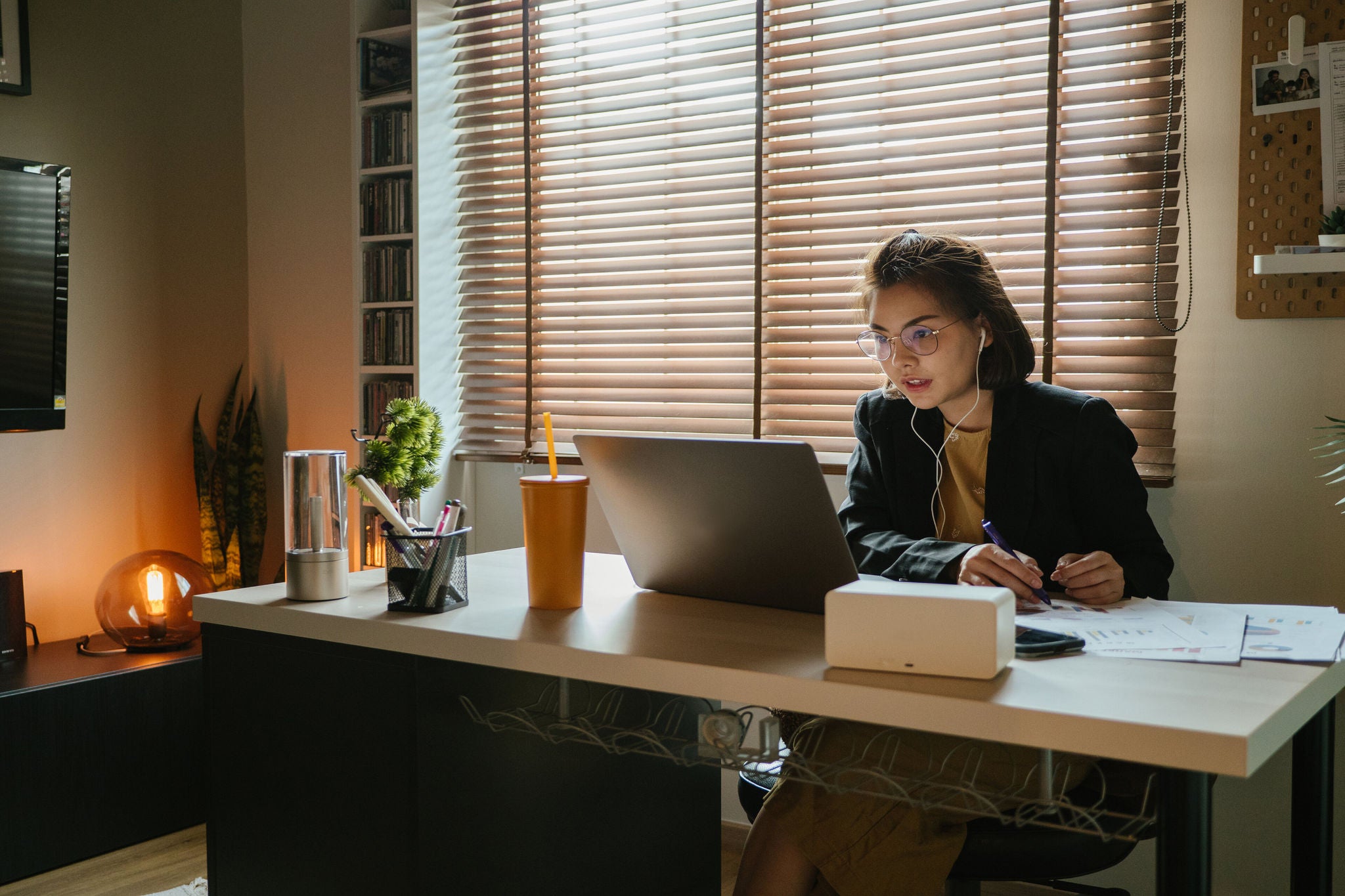 Young asian businesswoman working on laptop computer at home