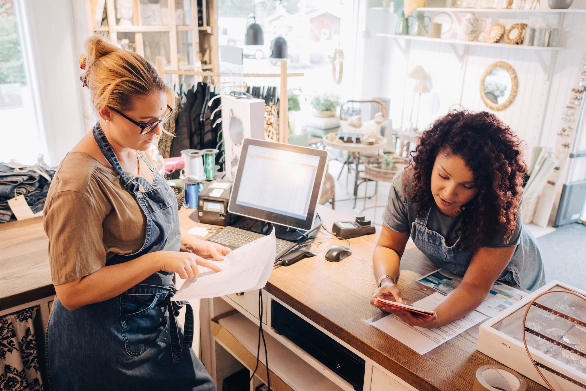 Two women calculating