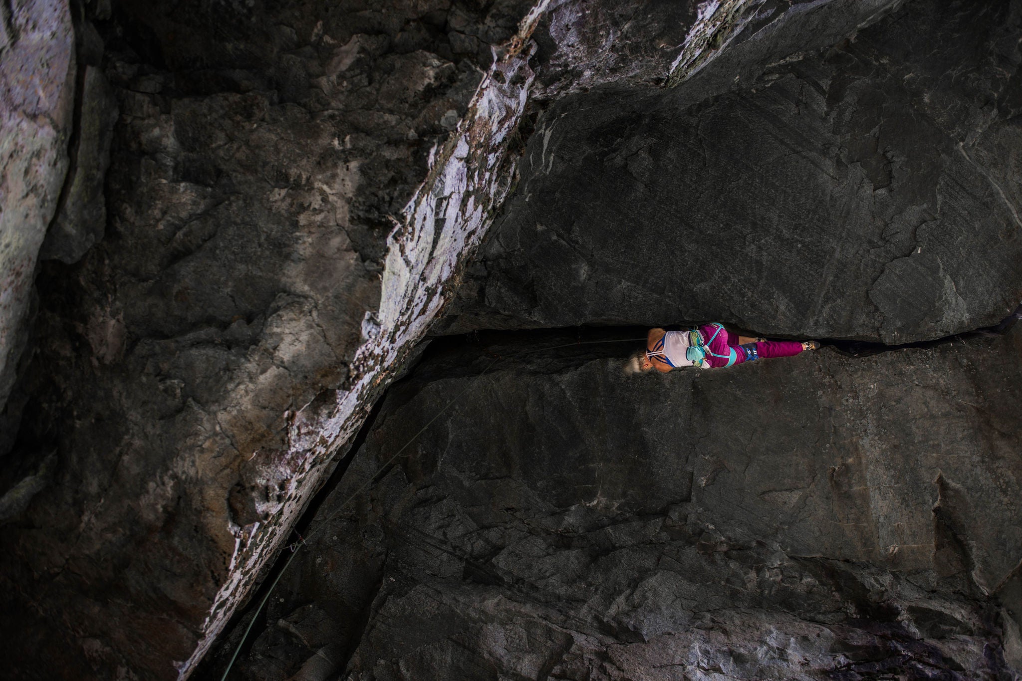 woman climbing mountain roof in Squamish, Canada