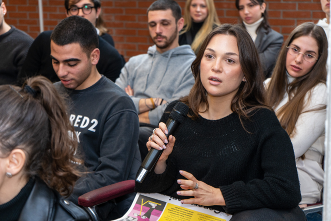 A person from audience asking a question