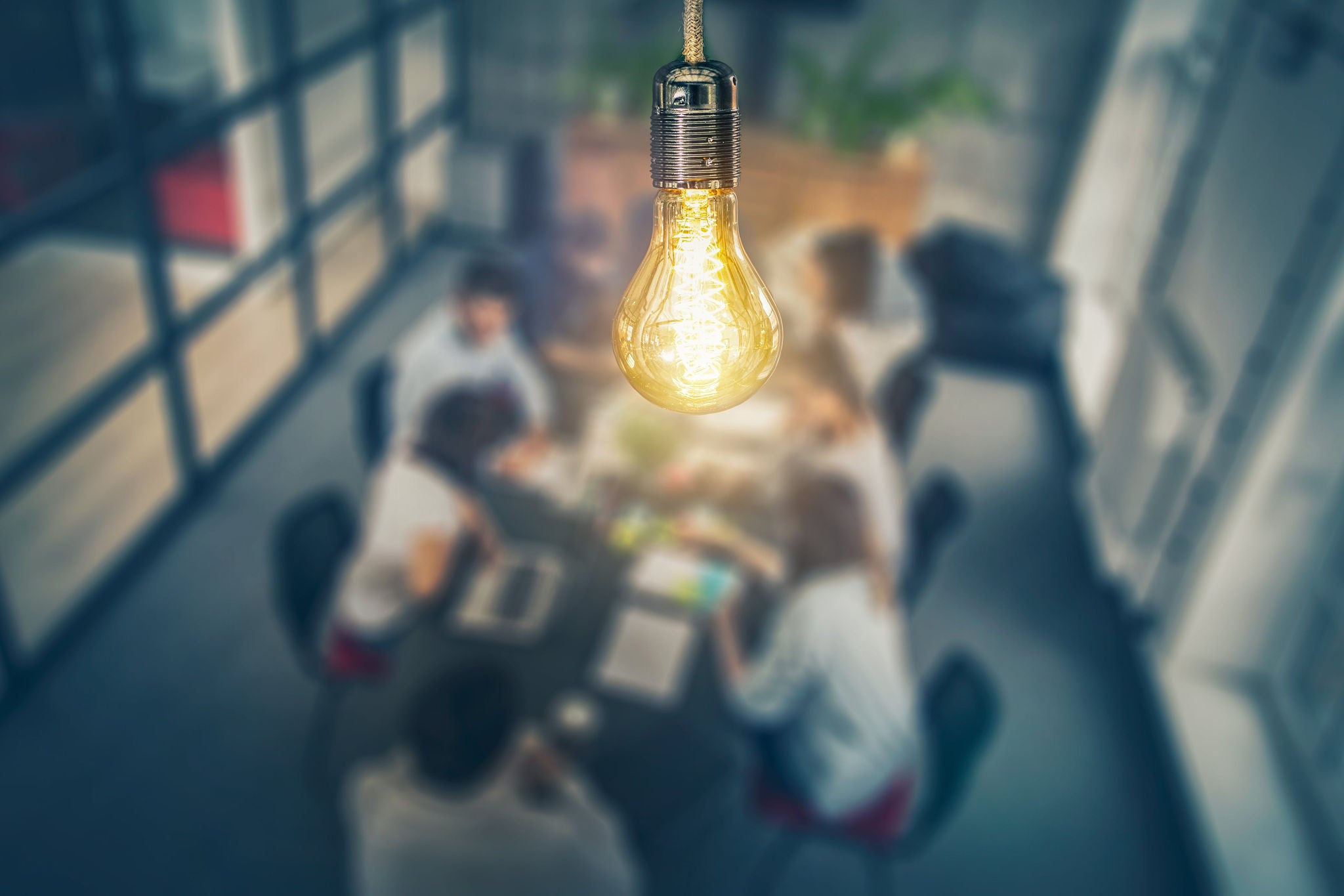 lightbulb focused within boardroom