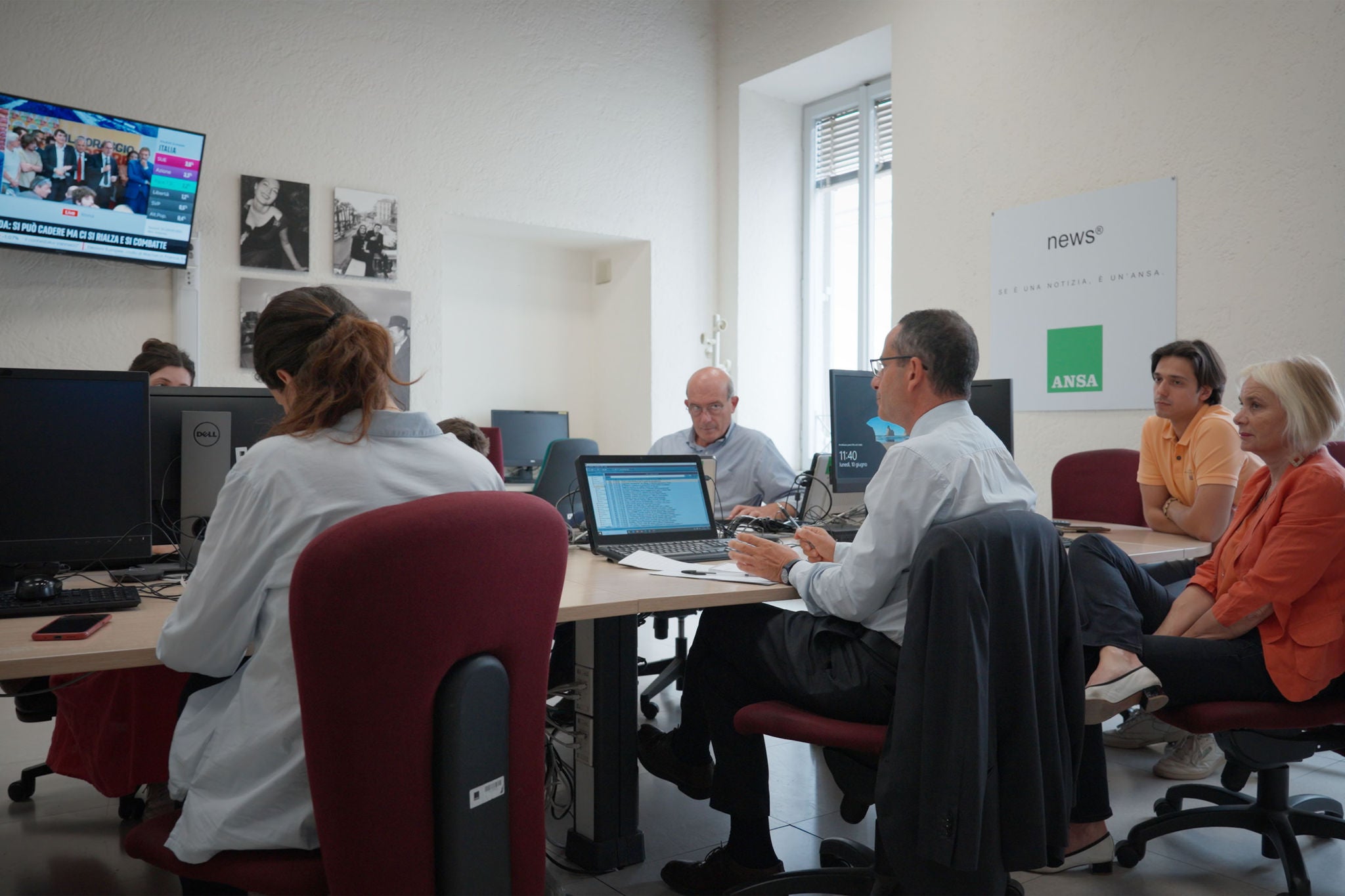 The Ansa editorial team are seen in the newsroom